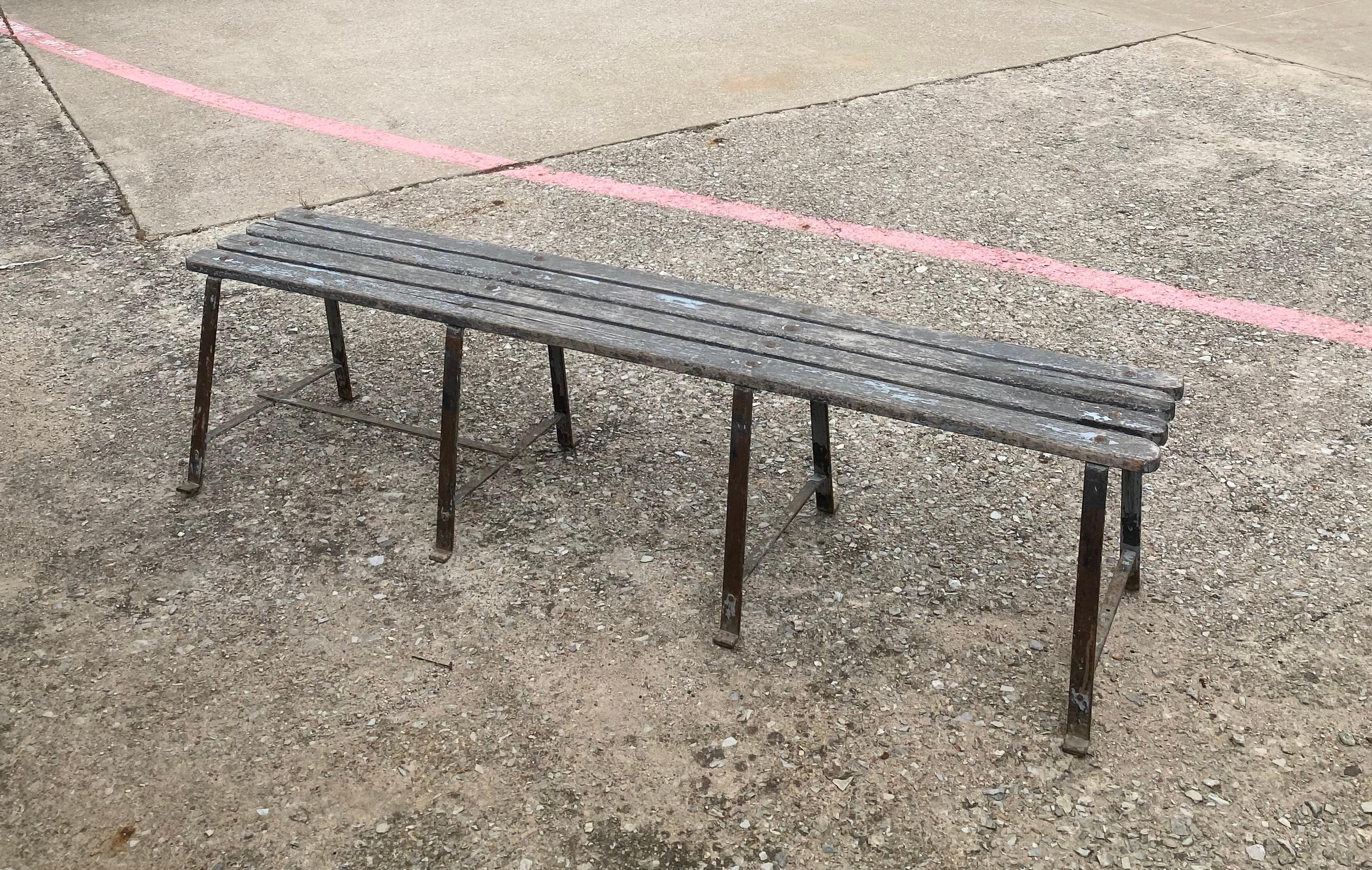 Incredible French Midcentury wood and iron bench with incredible, naturally developed patina.

There are remnants of blue paint, which has mostly weathered away, but bits do cling onto the wood and steel in the most perfect way possible. 

The wood