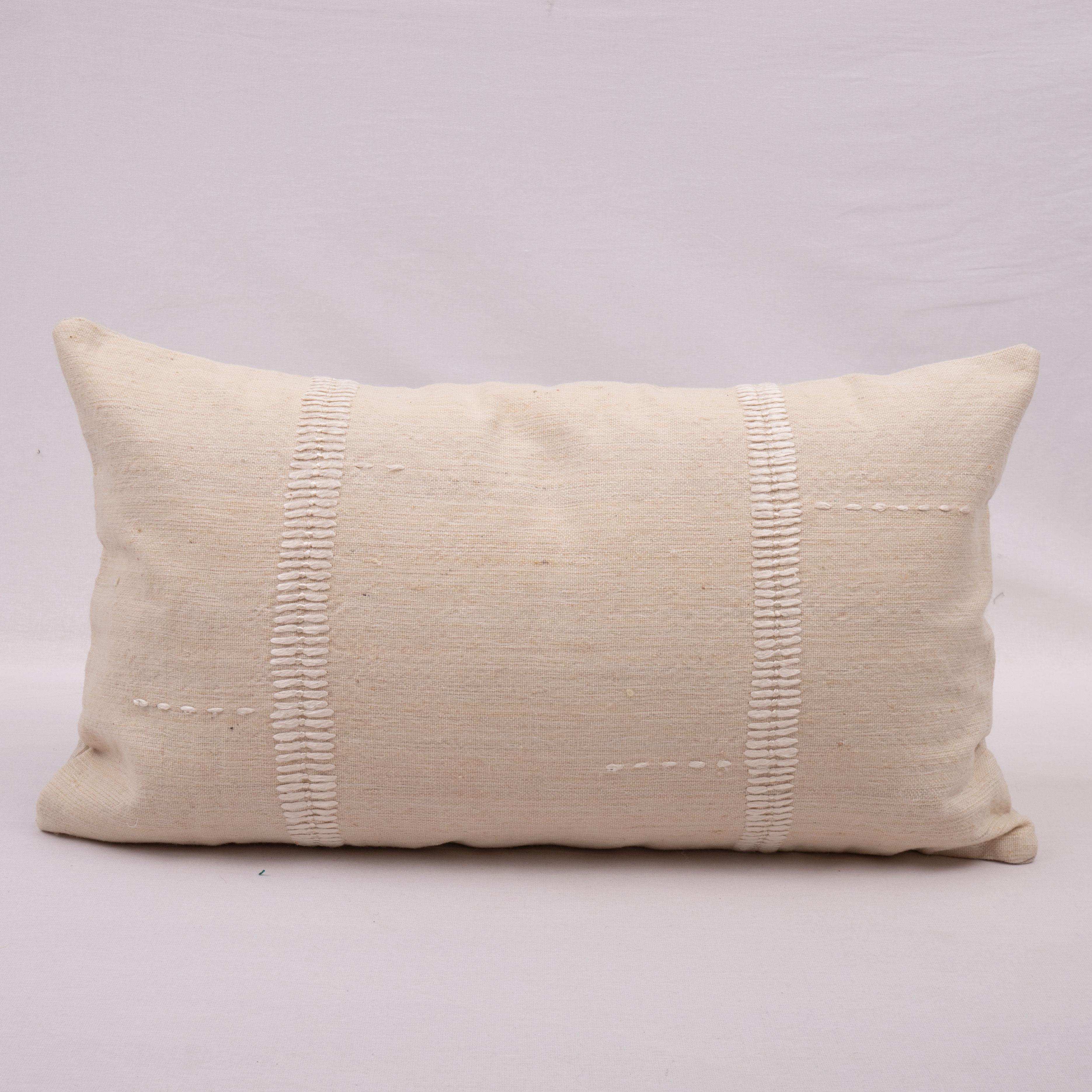 This pillow case is made from a vintage Anatolian Cotton Cover. Hand done silk stitching on it is our addition to the piece to give it a fine detail.

It does not come with inserts.
linen in the back.
Zipper closure.
Dry Cleaning is