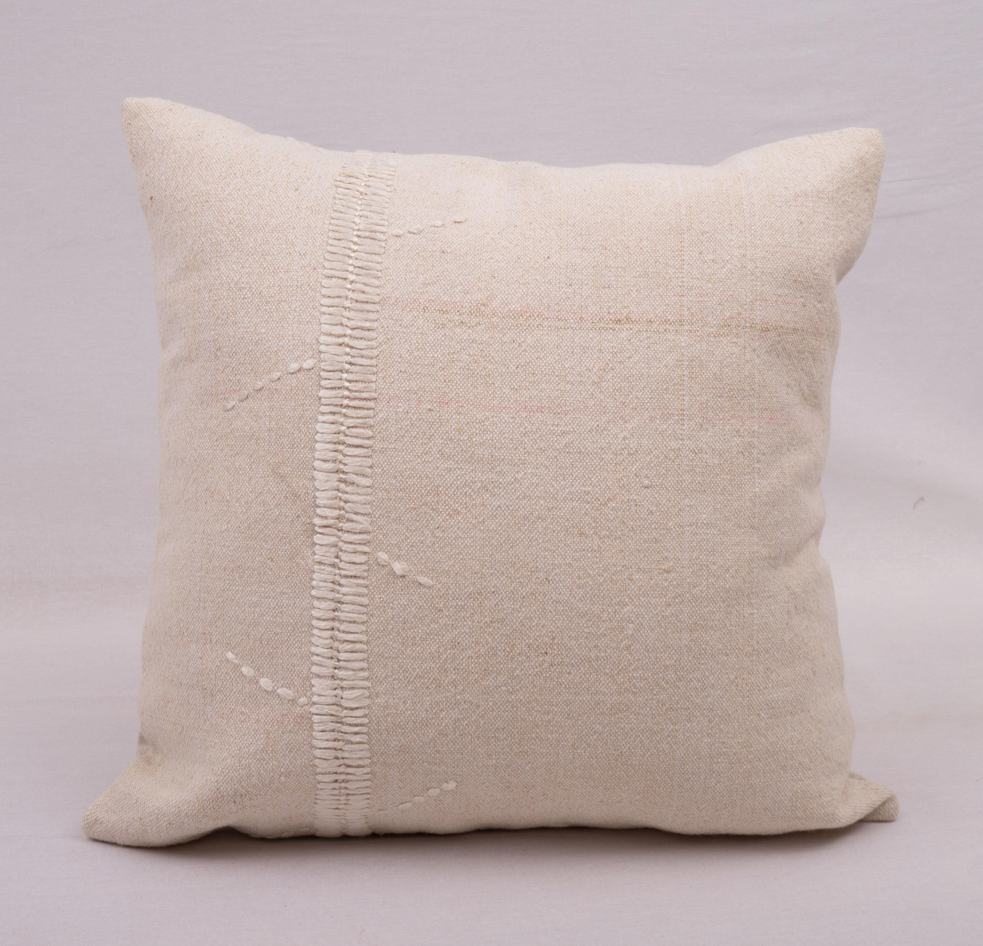This pillow case is made from a vintage Anatolian cotton cover. Hand done silk stitching on it is our addition to the piece to give it a fine detail.

It does not come with inserts.
linen in the back.
Zipper closure.
Dry Cleaning is
