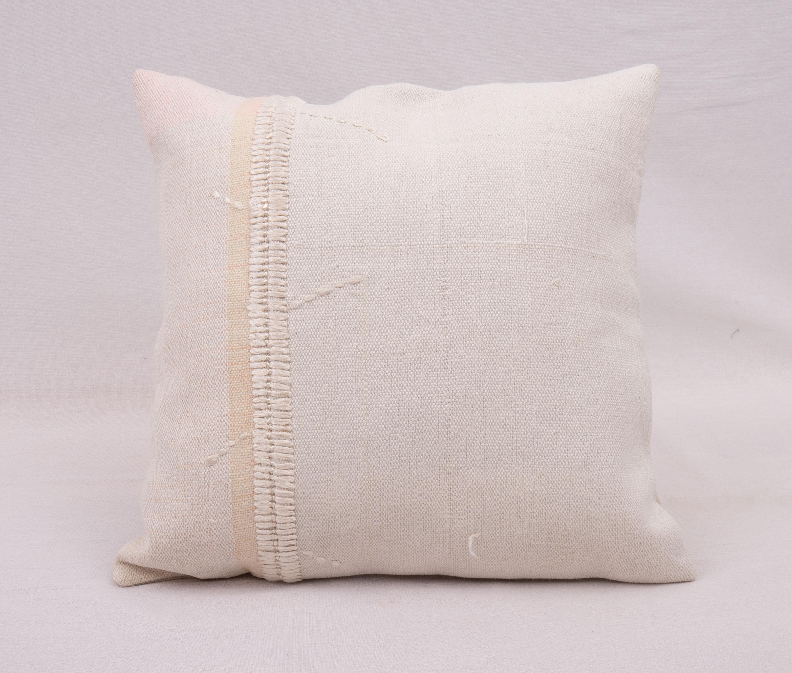 This pillow case is made from a vintage Anatolian cotton cover. Hand done silk stitching on it is our addition to the piece to give it a fine detail.

It does not come with inserts.
linen in the back.
Zipper closure.
Dry cleaning is