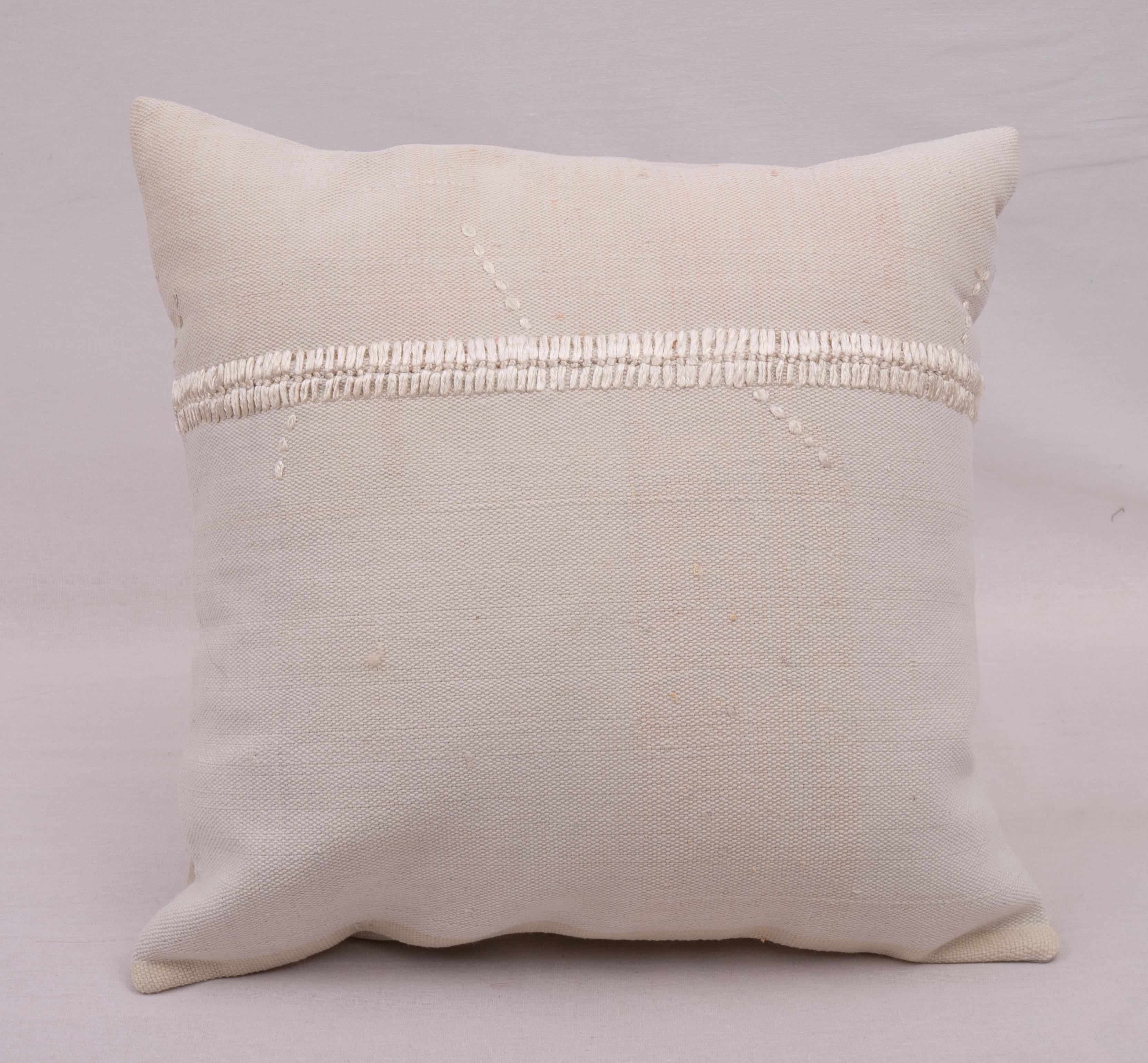 This pillow case is made from a vintage Anatolian Cotton Cover. Hand done silk stitching on it is our addition to the piece to give it a fine detail.

It does not come with inserts.
linen in the back.
Zipper closure.
Dry cleaning is