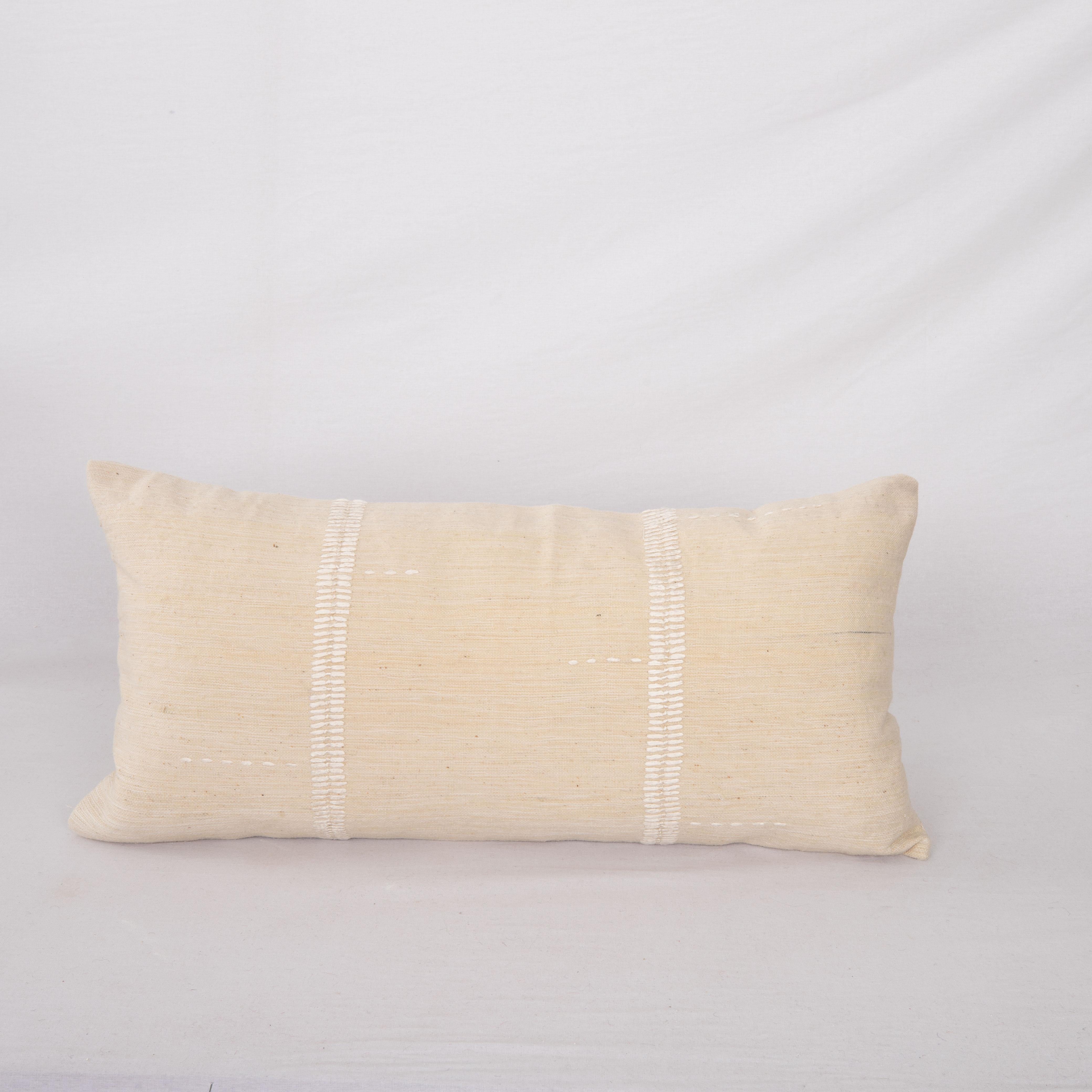This pillow case is made from a vintage Anatolian Cotton Cover. Hand done silk stitching on it is our addition to the piece to give it a fine detail.

It does not come with inserts.
linen in the back.
Zipper closure.
Dry cleaning is reccommended
