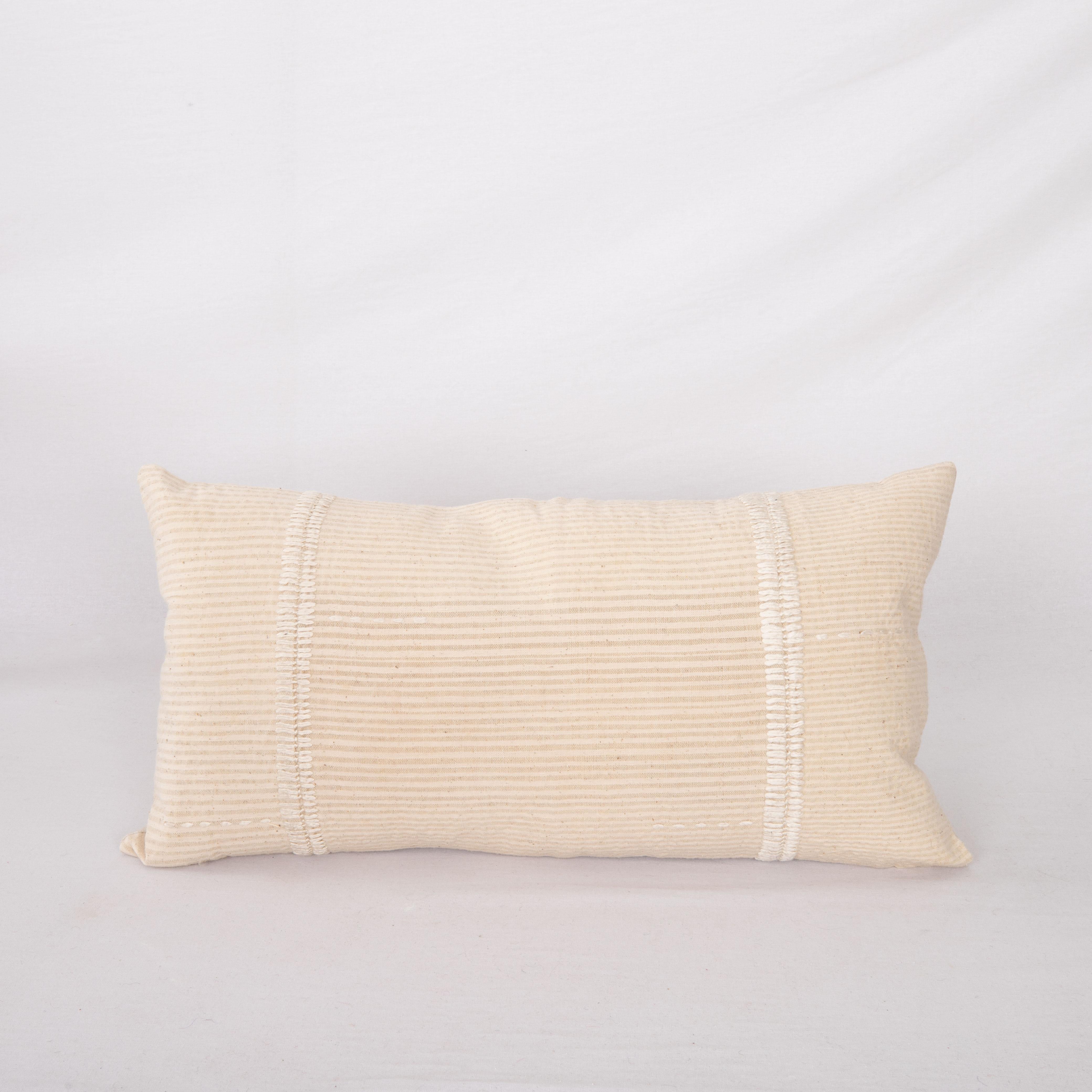 This pillow case is made from a vintage Anatolian Cotton Cover. Hand done silk stitching on it is our addition to the piece to give it a fine detail.

It does not come with inserts.
linen in the back.
Zipper closure.
Dry cleaning is reccommended.
