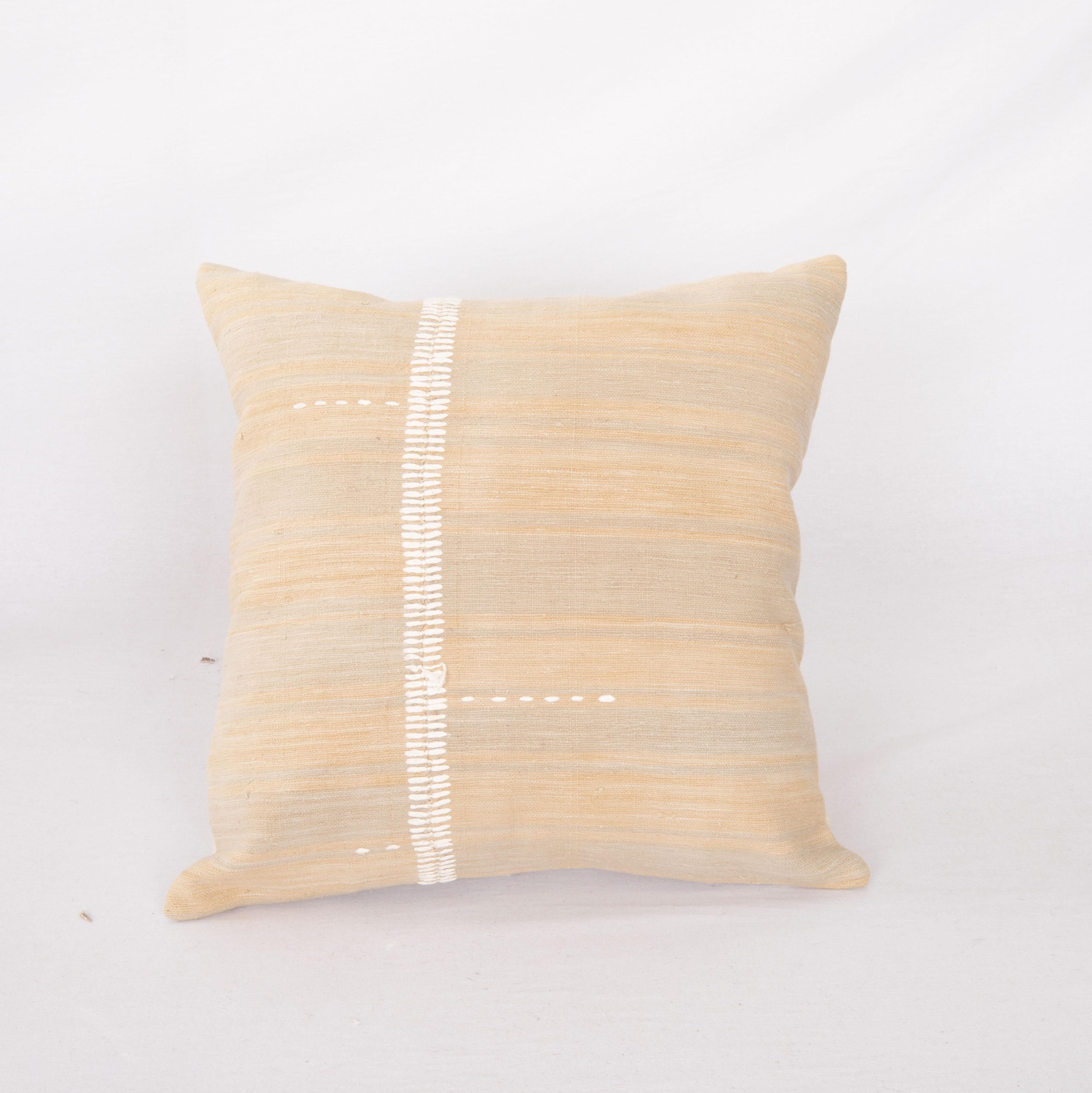 This pillow case is made from a vintage Anatolian Cotton Cover. Hand done silk stitching on it is our addition to the piece to give it a fine detail.

It does not come with inserts.
linen in the back.
Zipper closure.
Dry cleaning is reccommended
