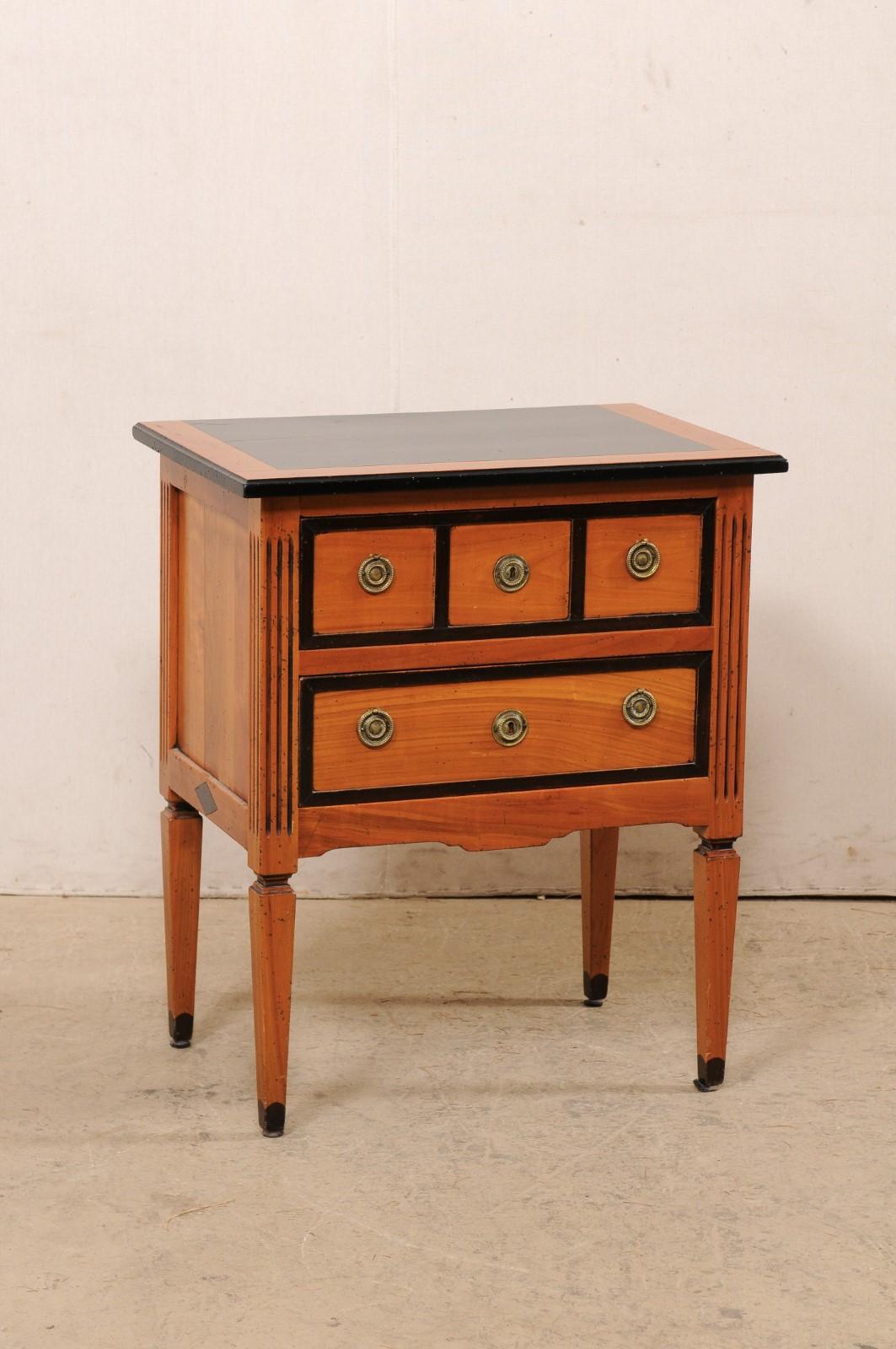 An American wood-carved raised side chest with drawers, circa 1960's. This mid-century commode was created 