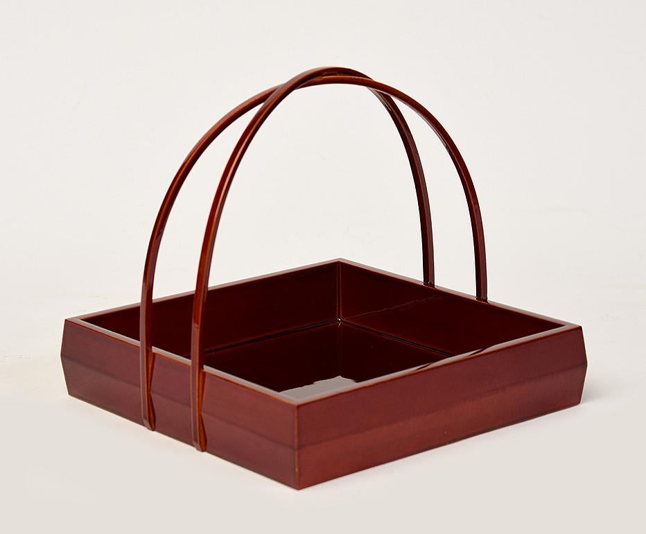Japanese lacquered basket for flower arrangement (Ikebana).

Age: Japan, Showa Period, Mid-20th Century
Size: Height 14.8 C.M. / Width 17 C.M. / Length 17 C.M.
Condition: Nice condition overall. 