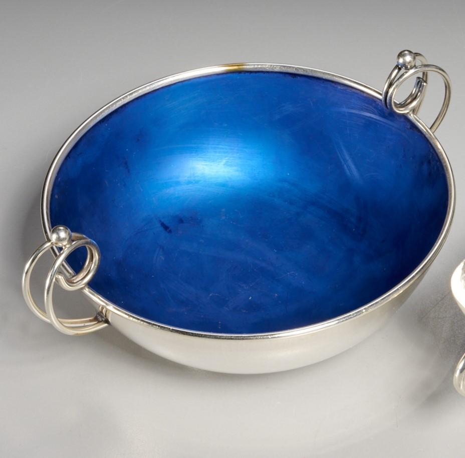 Mid-20th c., a Danish sterling bowl with blue enamel interior and wire scroll handles, marked 