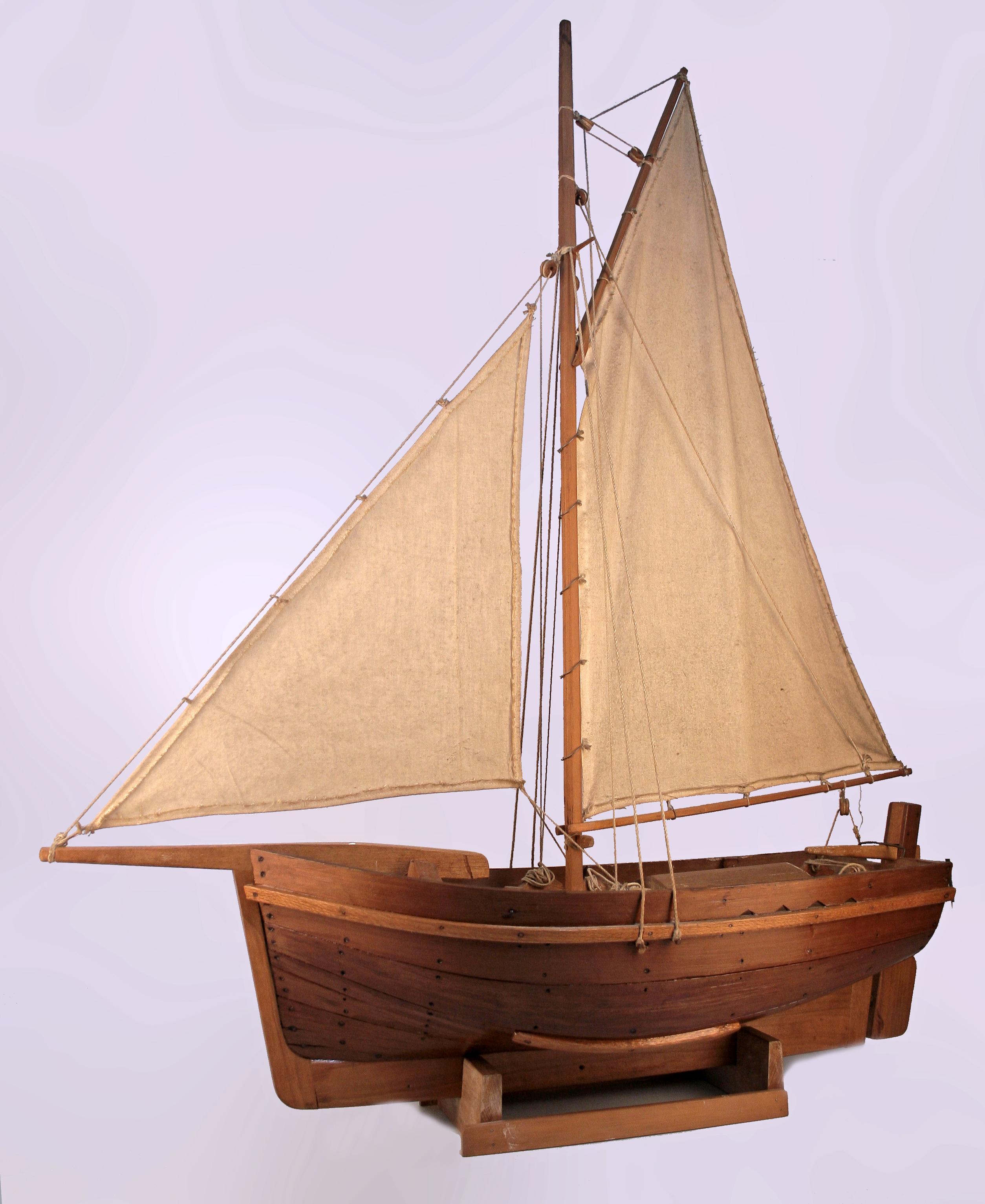 Mid-20th century wood model of antique fishing boat ship with sails made in Argentina

By: unknown
Material: wood, thread, fabric
Technique: carved, hand-carved, hand-crafted, varnished
Dimensions: 34 in x 12 in x 42 in
Date: mid-20th century
Style: