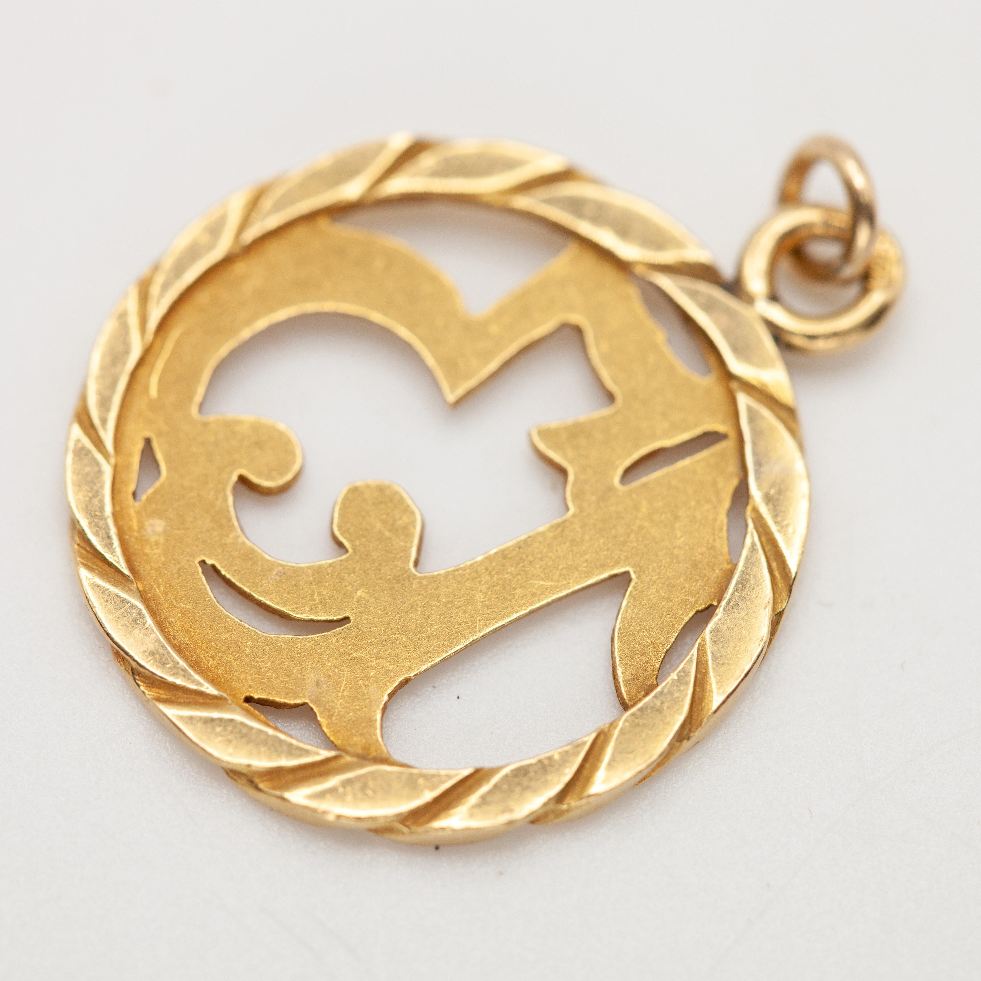 This charm is crafted in solid 18K yellow gold and features the number 13 in an elegant, stylized openwork design framed by a twisted rope border. The number 13 as a lucky charm was especially popular in Mexican, Spanish, and Italian gold jewelry of
