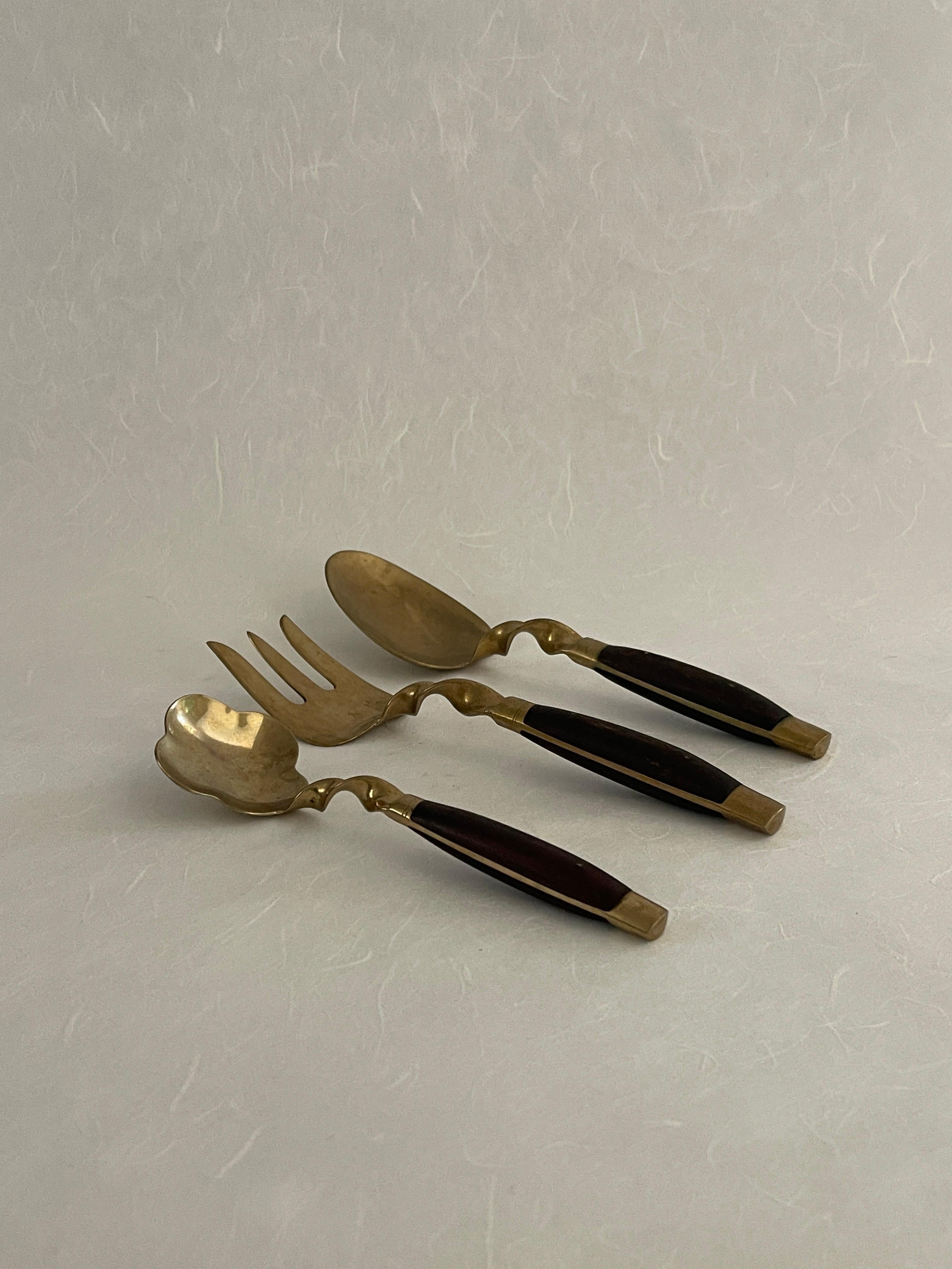 brass and rosewood cutlery set