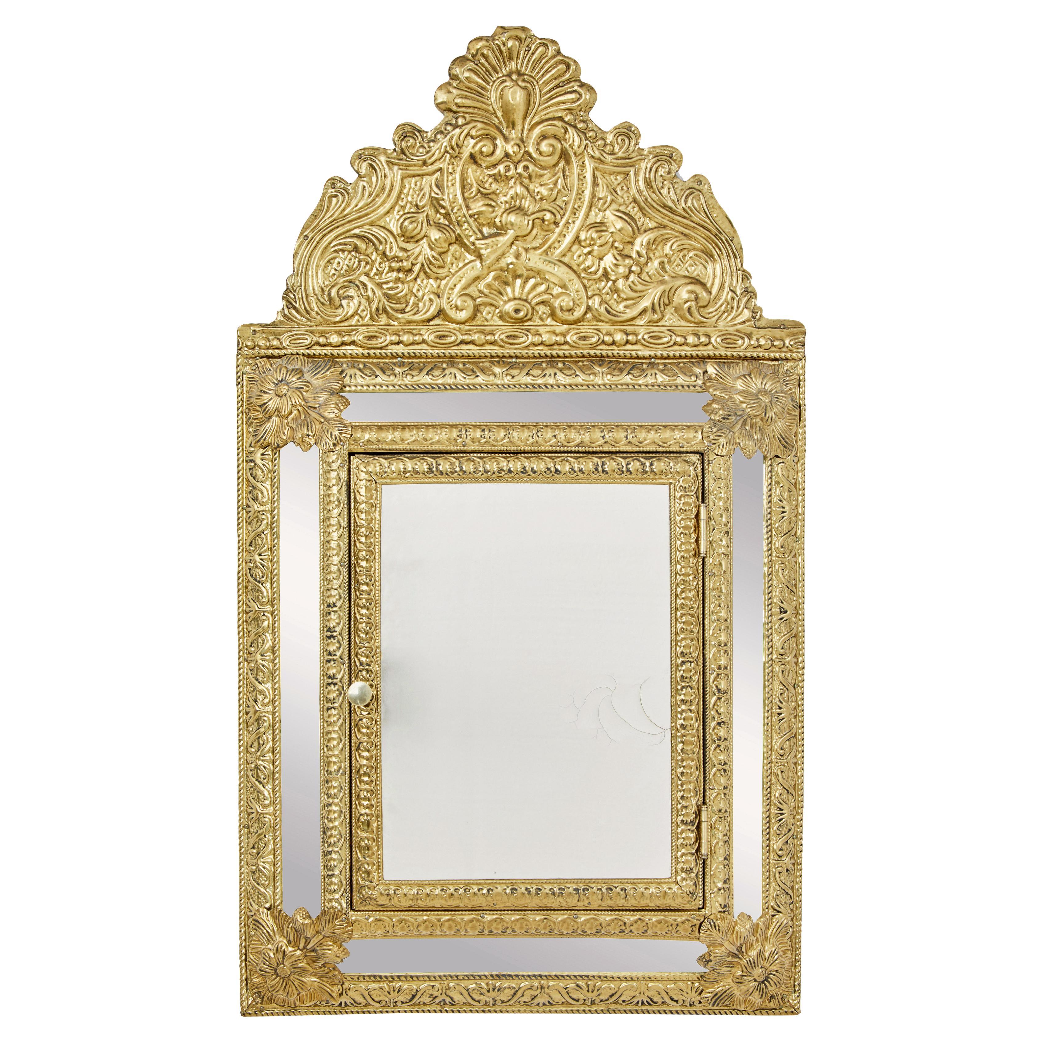 Mid 20th century aesthetic movement inspired brass hall cushion mirror For Sale