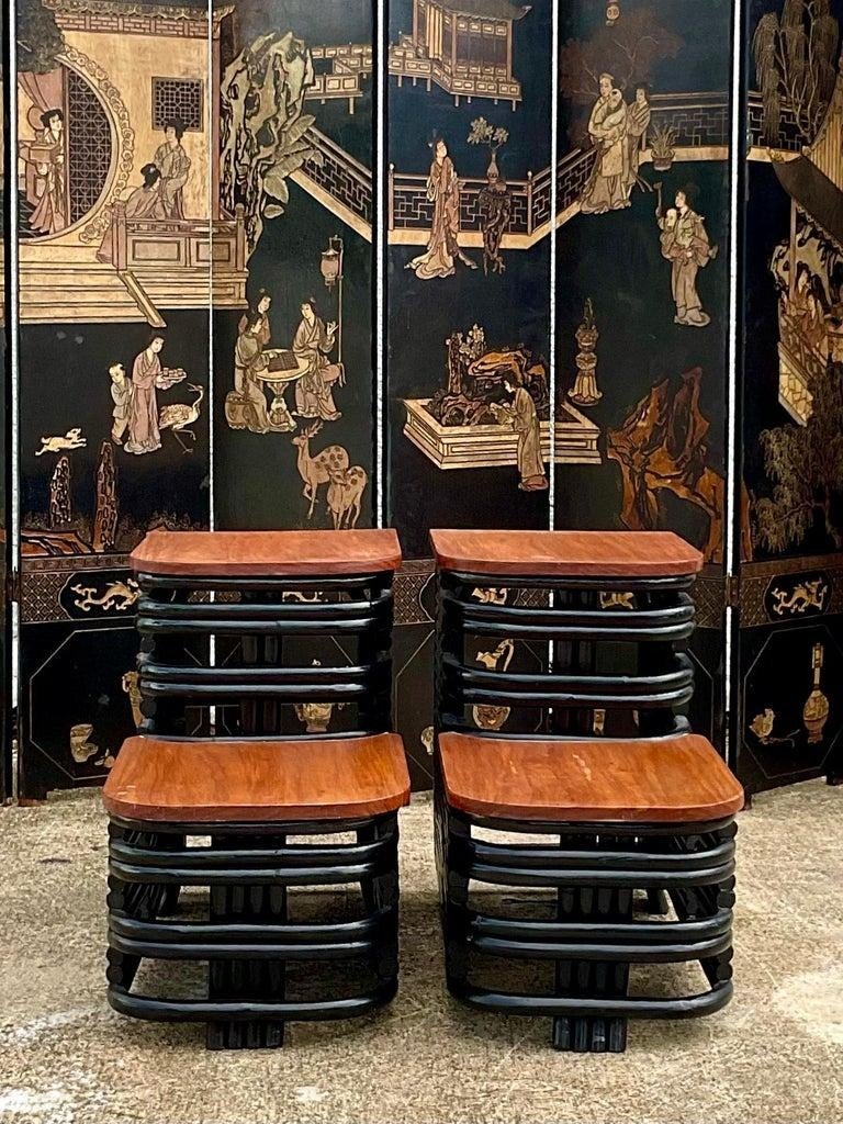 Fantastic pair of vintage end tables. Made in thr manner of the iconic Paul Frankl. A gorgeous matte black painted finish. Acquired from a Palm Beach estate.