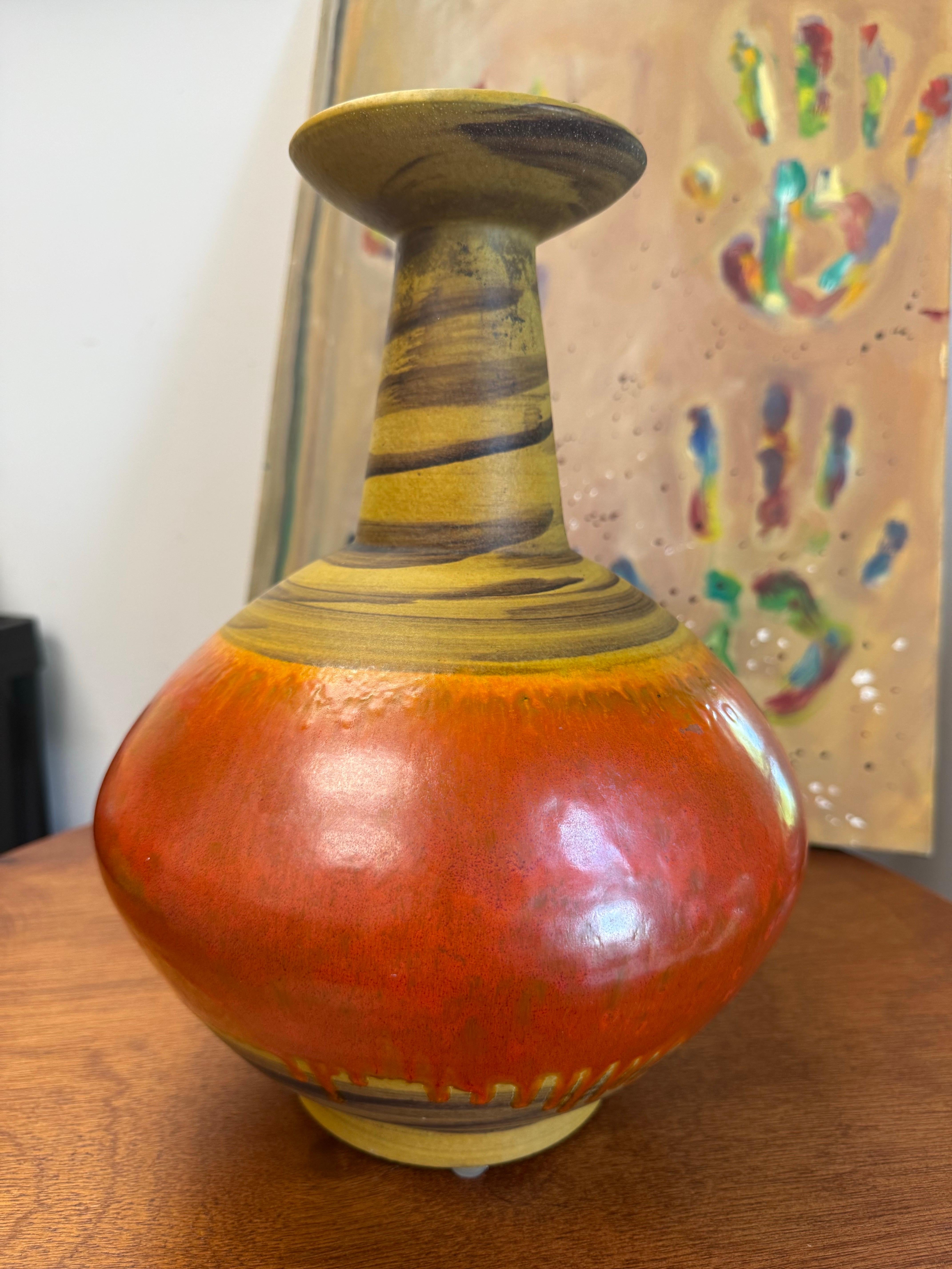 Bagni for Raymor vase, ceramic, orange red and yellow, signed. Large chunky vase with dark yellow and brown glazed elongated neck, green and orange mouth and red/orange glazed bulbous body. Alvino Bagni's studio in Florence, along with Bitossi,