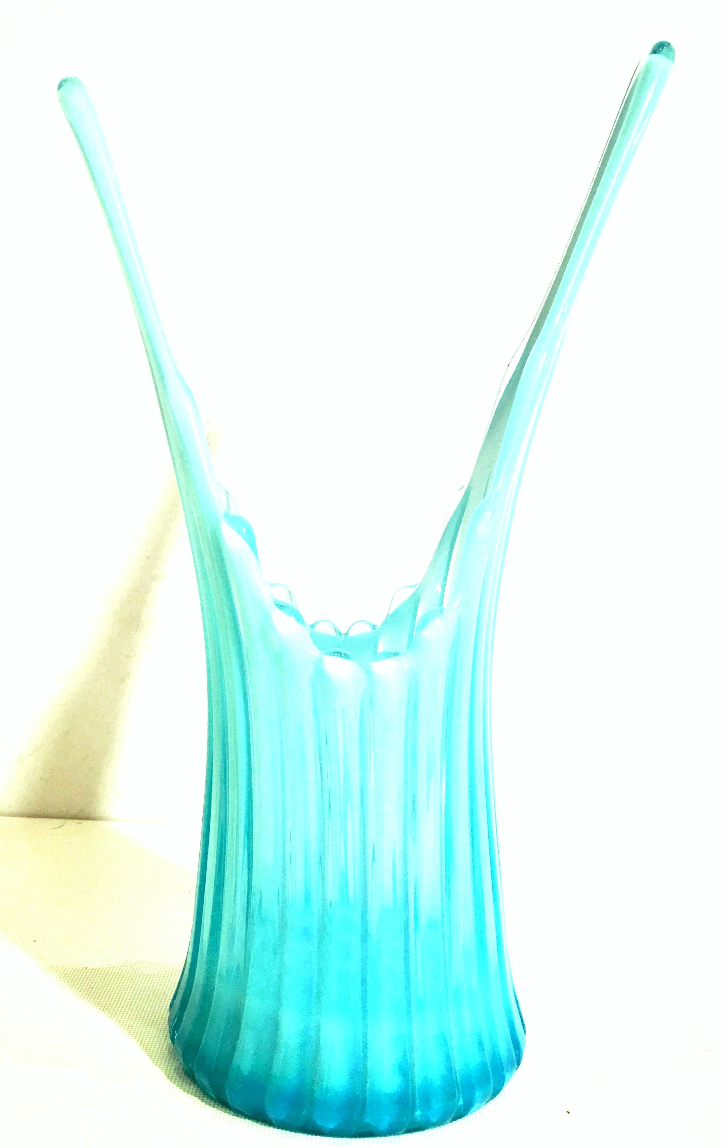 Mid-20th century American blown glass ribbed slag vase. Features a ribbed dimensional design in ombre opalescent sky blue tones. Features a fluted body stile with cased white detail.