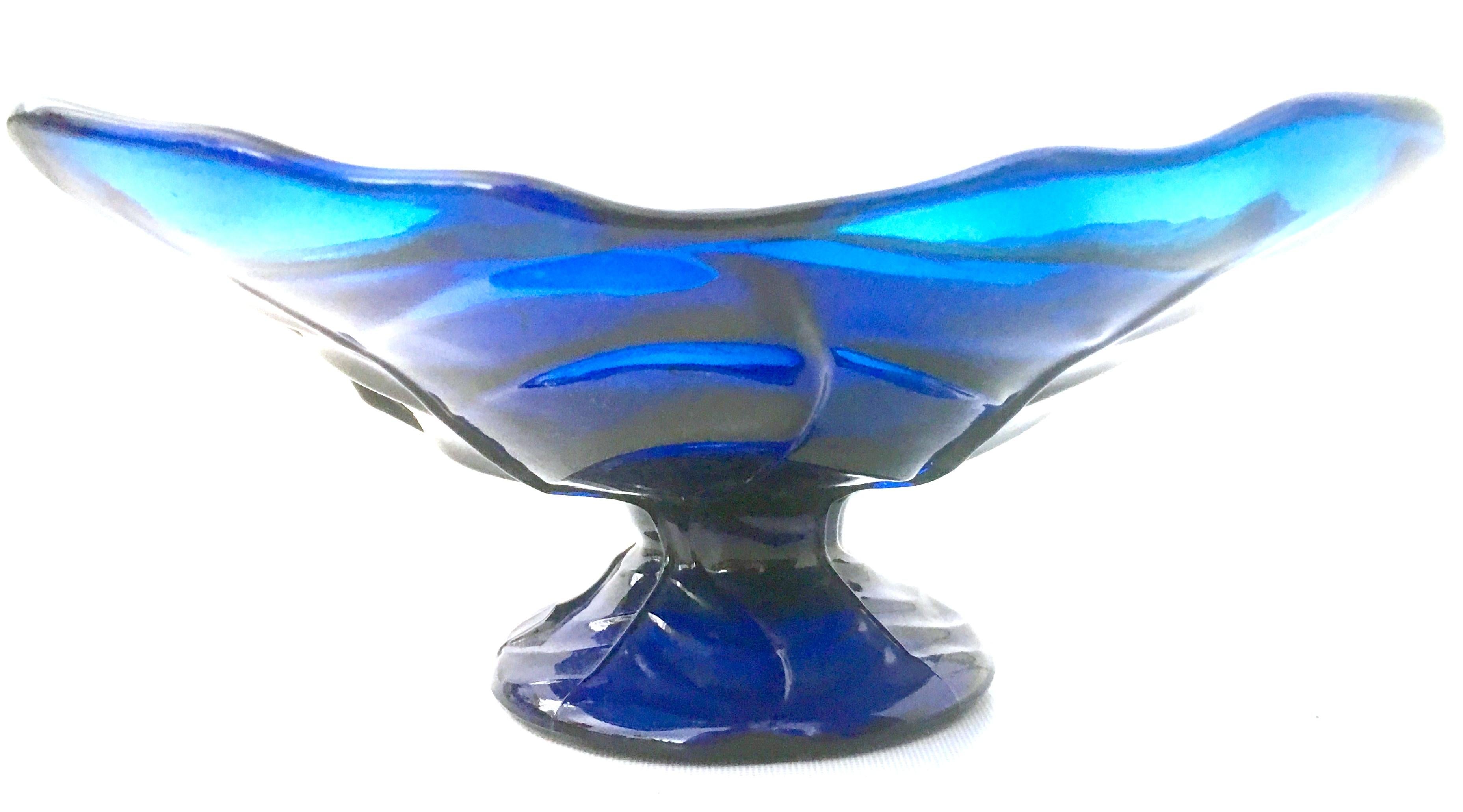 Mid-20th century American blown glass vivid blue footed pedestal dish. Features a dimensional and textured pattern of fauna.