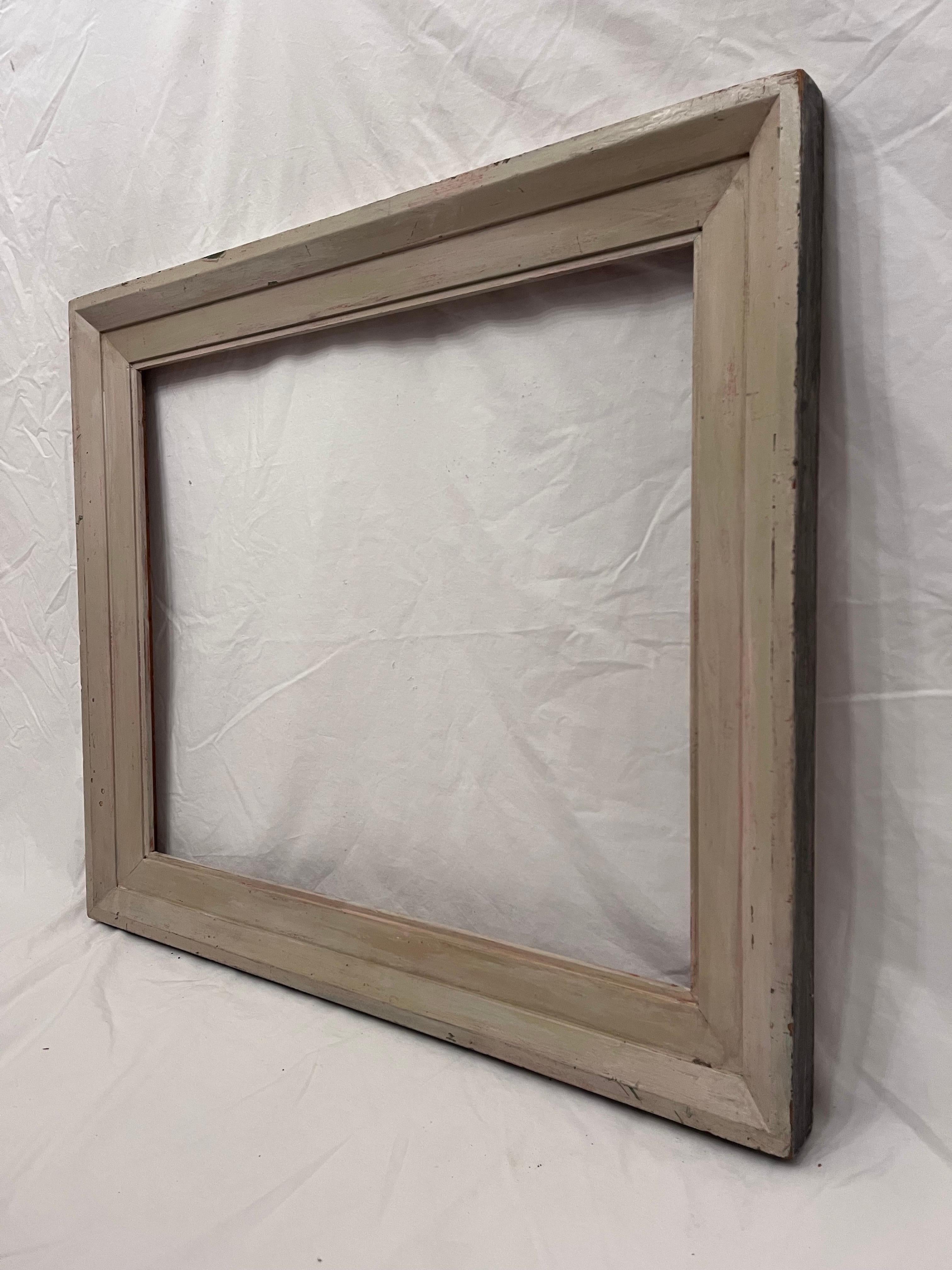 A beautiful and clean lined mid 20th century circa 1940's American Modernist style picture frame. The rabbet size (size that holds the art) is 24.25