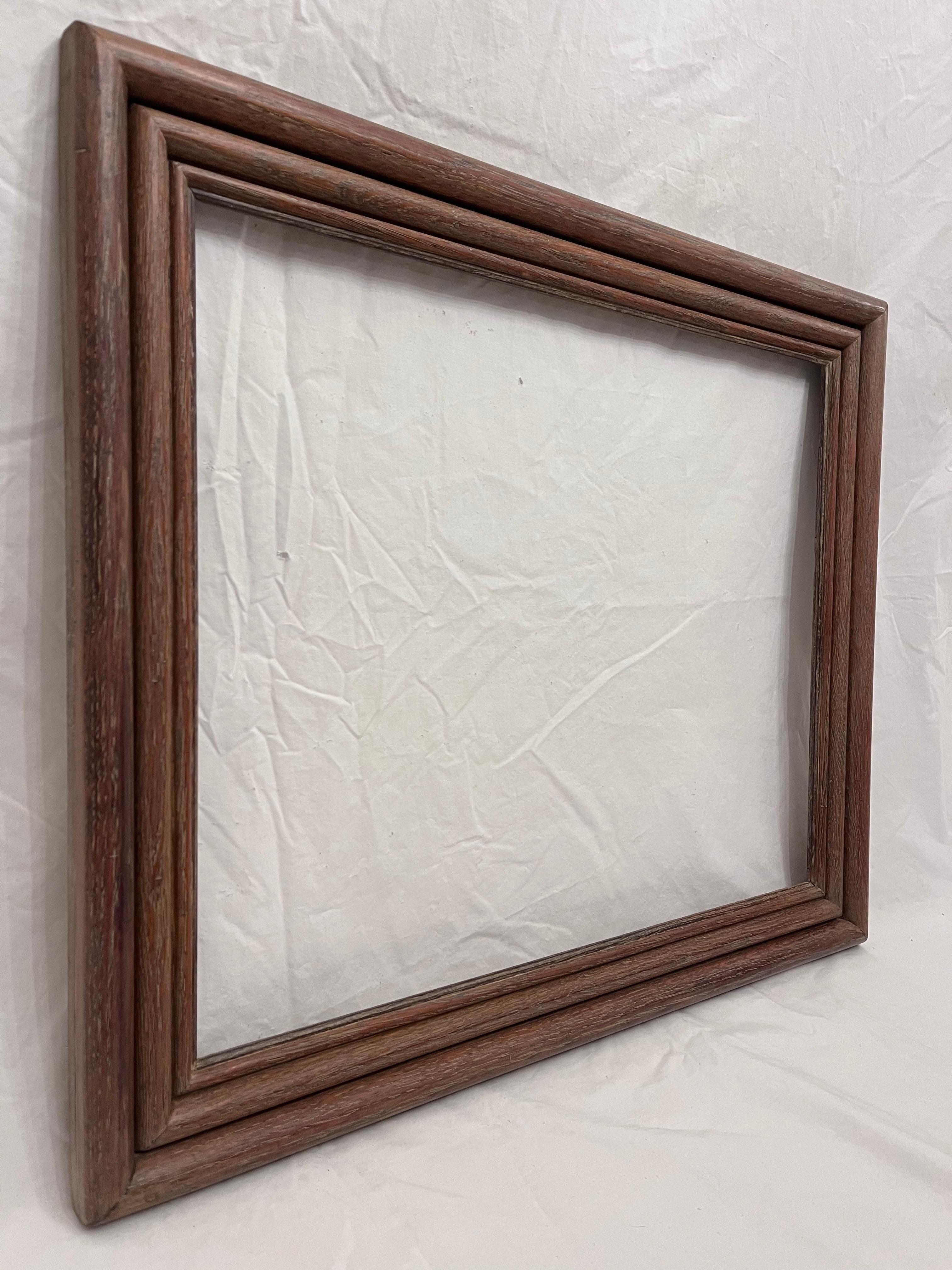 A beautiful and classically simple graduated triple bolection early to mid 20th century circa 1930's - 1940's American Modernist style picture frame. The rabbet size (size that holds the art) is 23