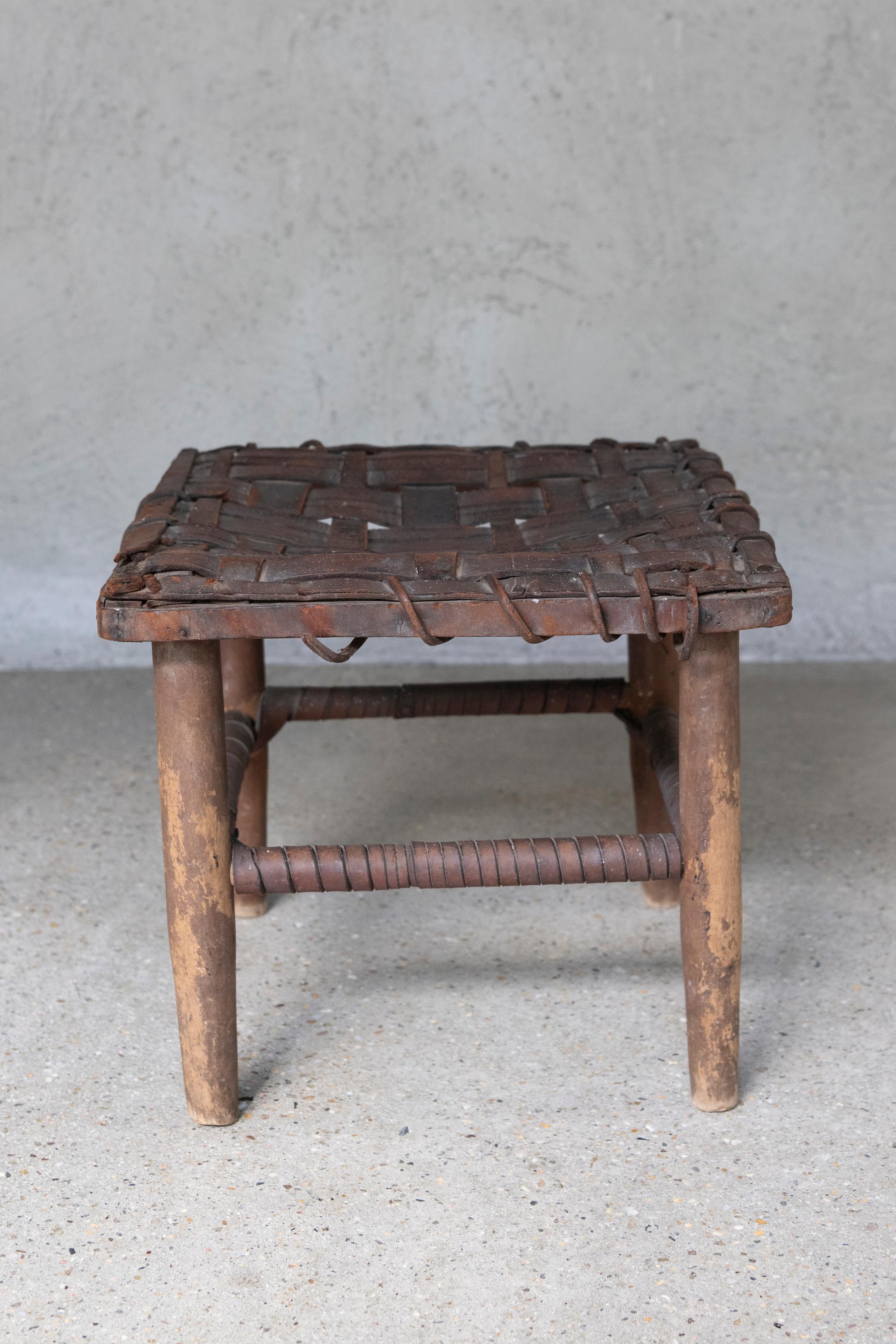 Mid 20th Century American Rustic Handwoven Leather & Wood Stool In Good Condition For Sale In Wainscott, NY