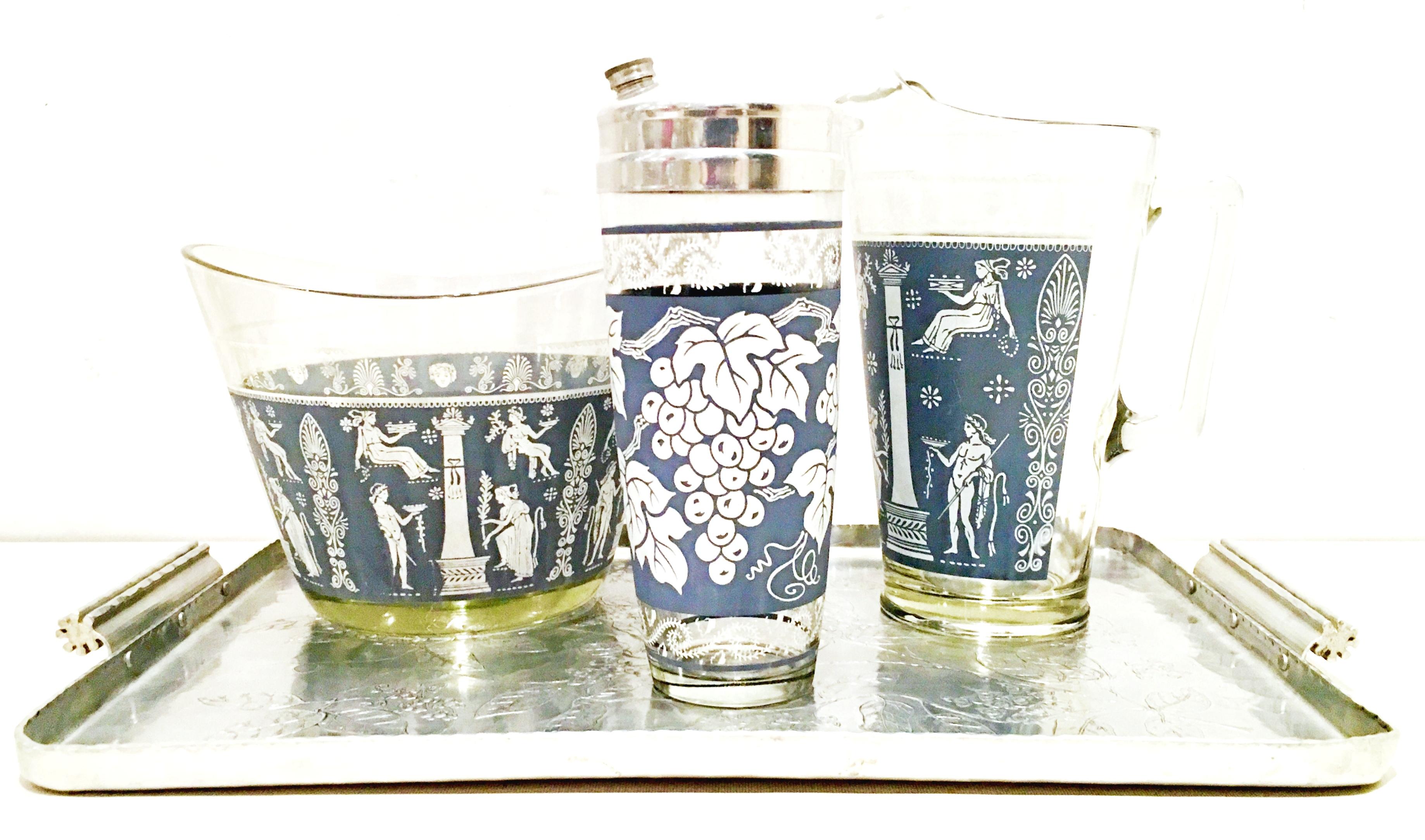 Mid-20th century American printed glass & silver hammered tray drinks, set of 4. This 4-piece set includes, 1 silver rectangular tray, 1 glass pitcher, 1 glass and chrome 3 piece cocktail shaker and oval shaped glass champagne or ice bucket. The