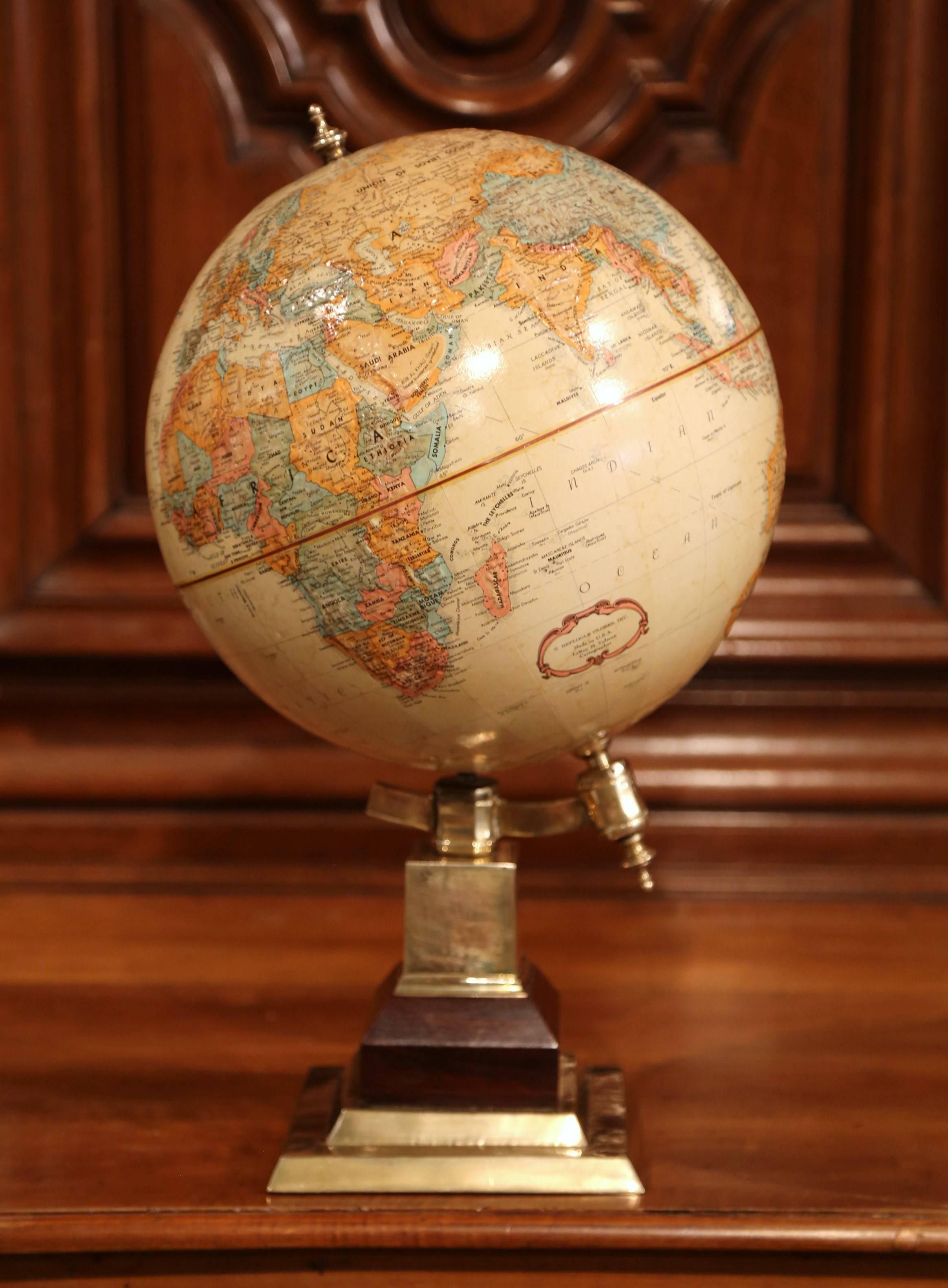 This beautifully preserved, vintage globe was crafted in the USA, circa 1980 (1984 – Upper Volta changes name to Burkina Faso). Sitting on a patinated brass base, this terrestrial globe has a very detailed map in relief, in a muted, neutral palette
