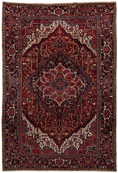 Mid 20th Century Antique Persian Heriz rug with rich reds, crimson, Burgundy