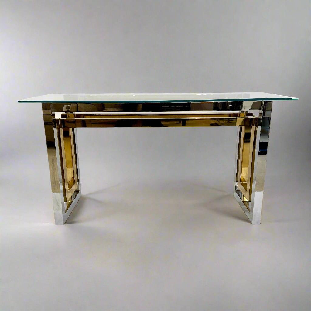 Chrome, Brass and Glass Console table by Romeo Riga, Italy c1960's. Architectural console table of concentric chrome and brass rectangular forms, surmounted with a glass top. 