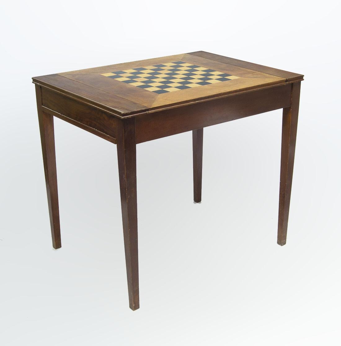 Mid-20th century argentine wooden desk/game table with chess and backgammon board by Comte S.A.

By: Comte S.A.
Material: wood, metal, leather
Technique: carved, varnished, hand-crafted, hand-carved
Dimensions: 26 in x  33.5 in x 29.5 in
Date: