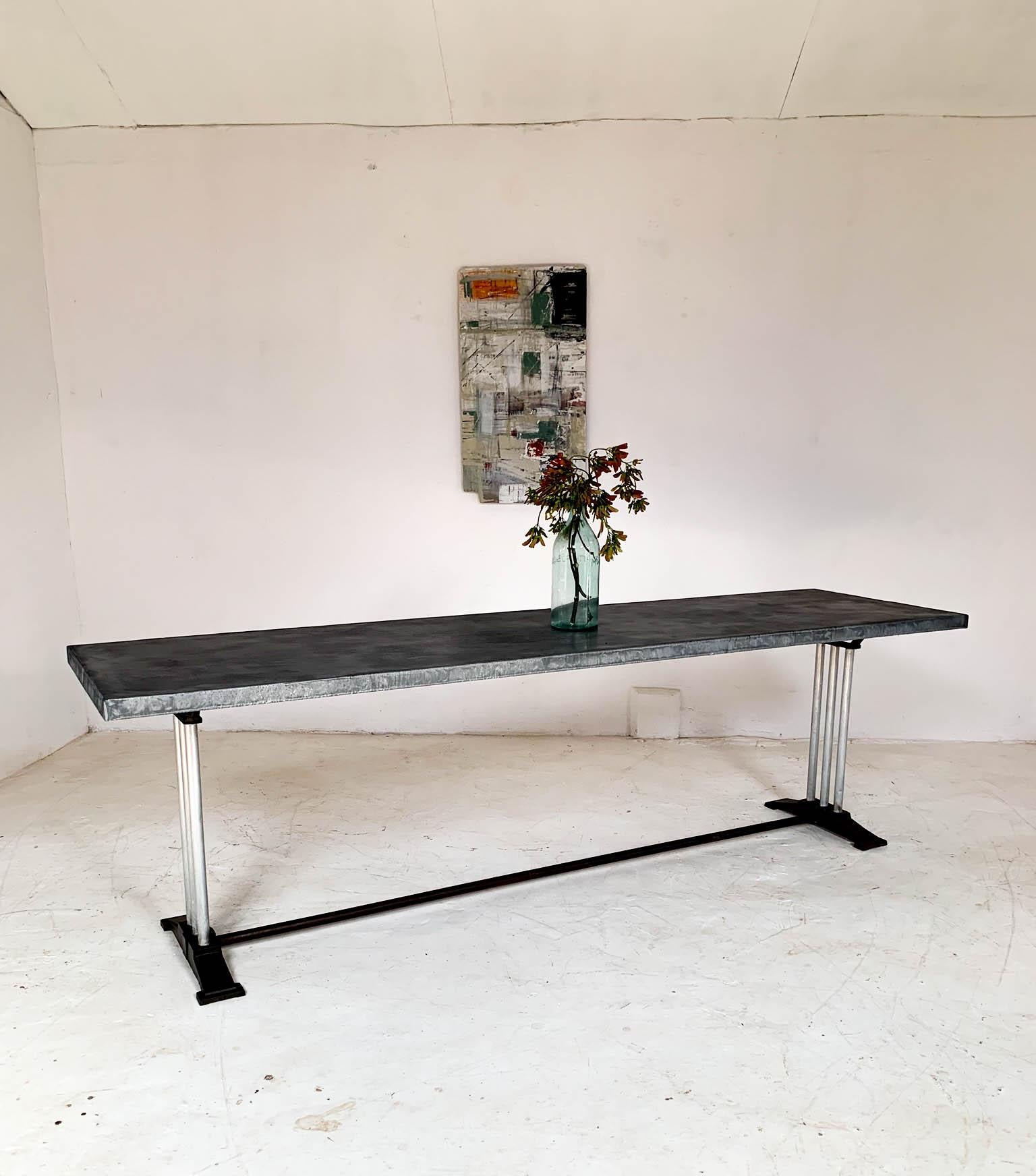 A very interesting and unusual 1930s table base sourced from France, that was originally used as a restaurant table. We really like the Art Deco style of the legs, which have cast iron bases marked 'Lelong' and three aluminum poles connecting the