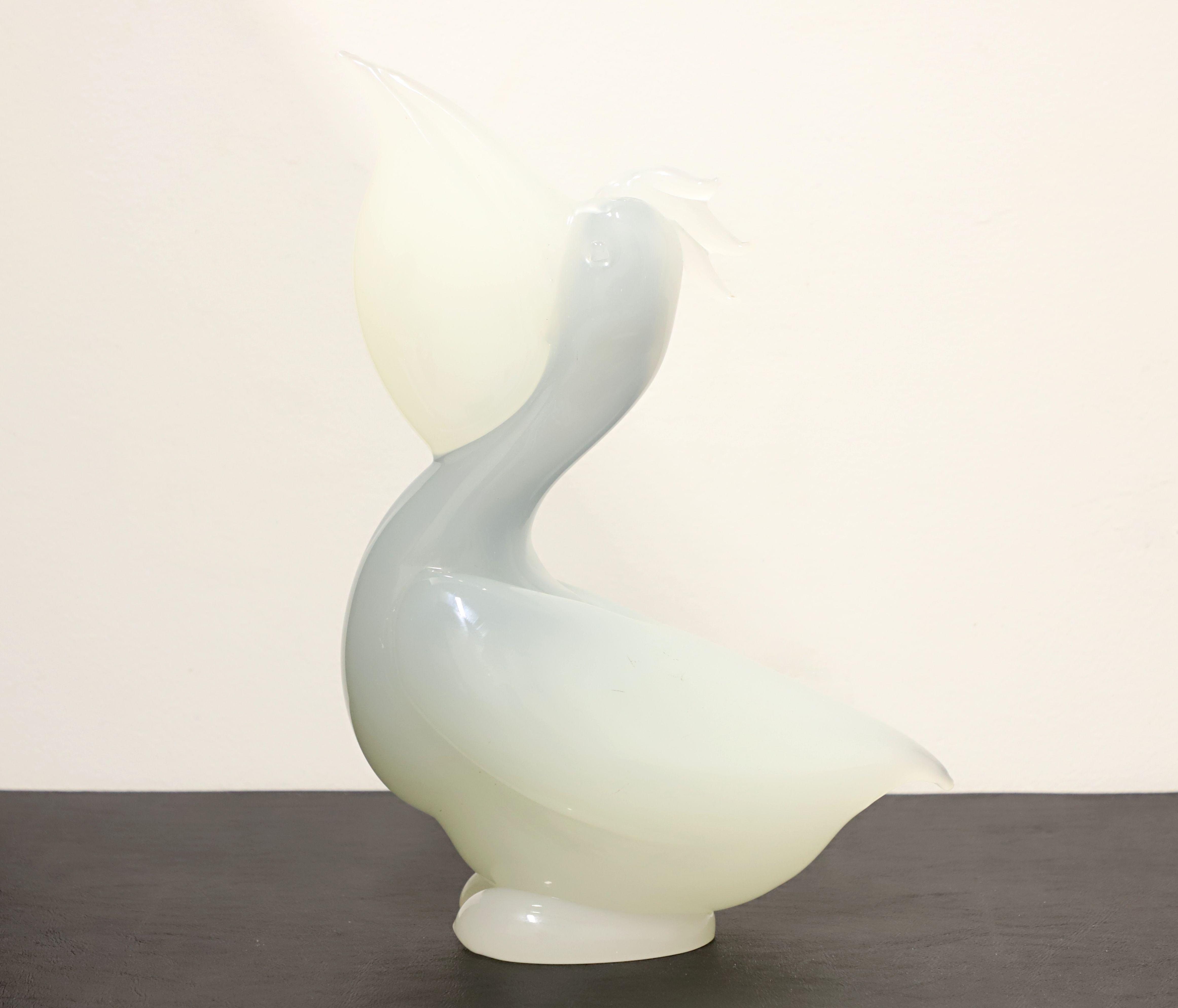 A Contemporary style art glass sculpture, unsigned, attributed to Gambaro & Poggi, of Murano. Opaque alabaster glass in shades of blue and white forming a pelican. Made in Italy, circa 1970's.

Measures: 9w 4d 12.75h, Weighs Approximately: 10 lbs
