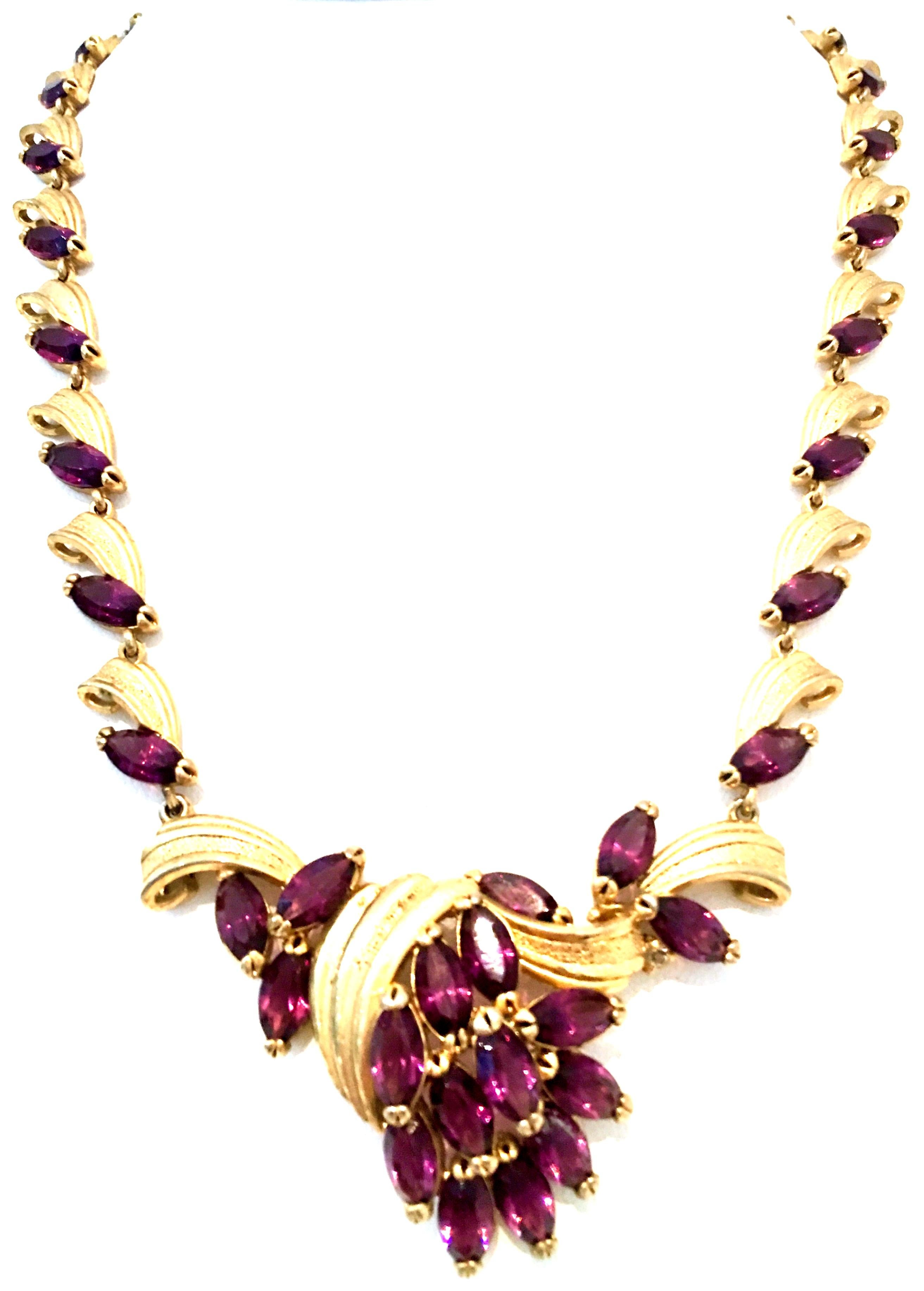 Mid-20th Century Gold & Amethyst Austrian Crystal Choker Style Link Necklace. This incredibly well crafted and dimensional gold plate link necklace features open back brilliant cut and faceted navette fancy prong set amethyst stones. There are