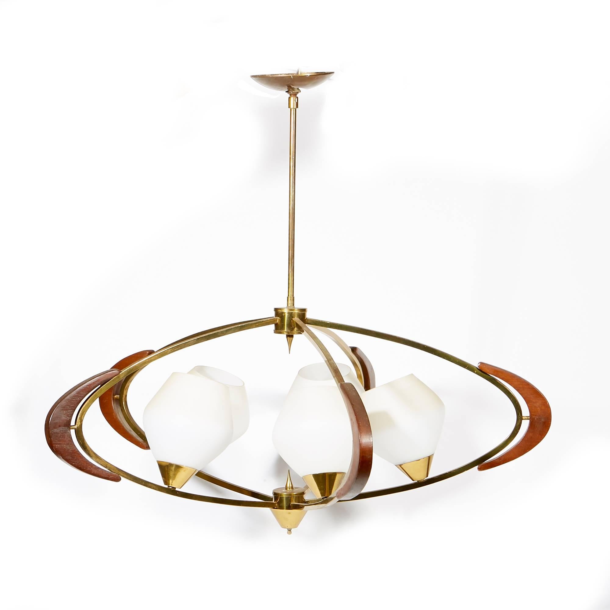 Mid-20th century atomic-style brass and walnut accented hanging pendant light with frosted white shades. Hard wired for the US. No marks.
