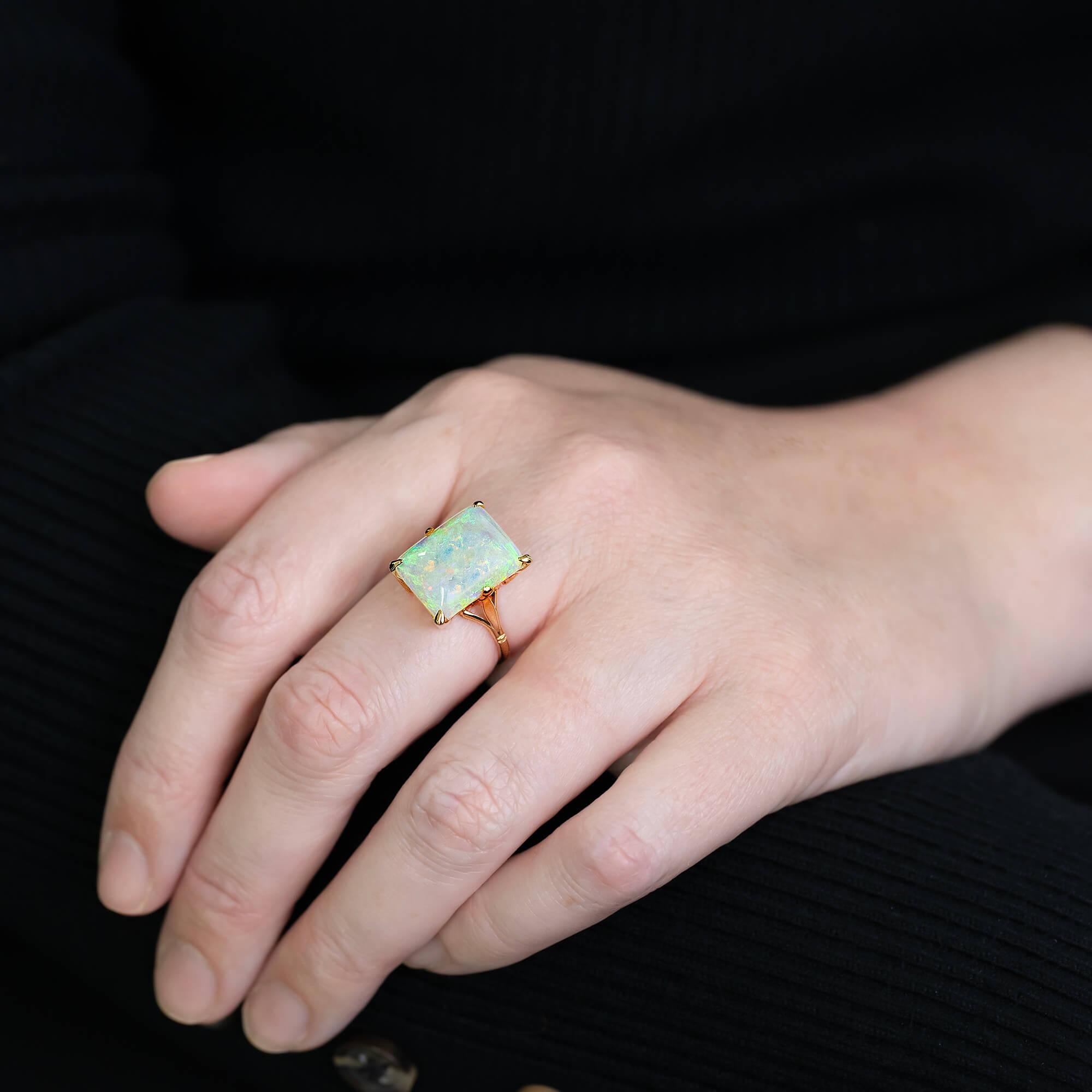 Mid 20th Century Australian opal ring featuring a handmade all yellow gold six claw box coronet with half-round shank. Recently restored and the opal re-polished this ring is ready for its next wearer.

Coober Pedy is a town located in South