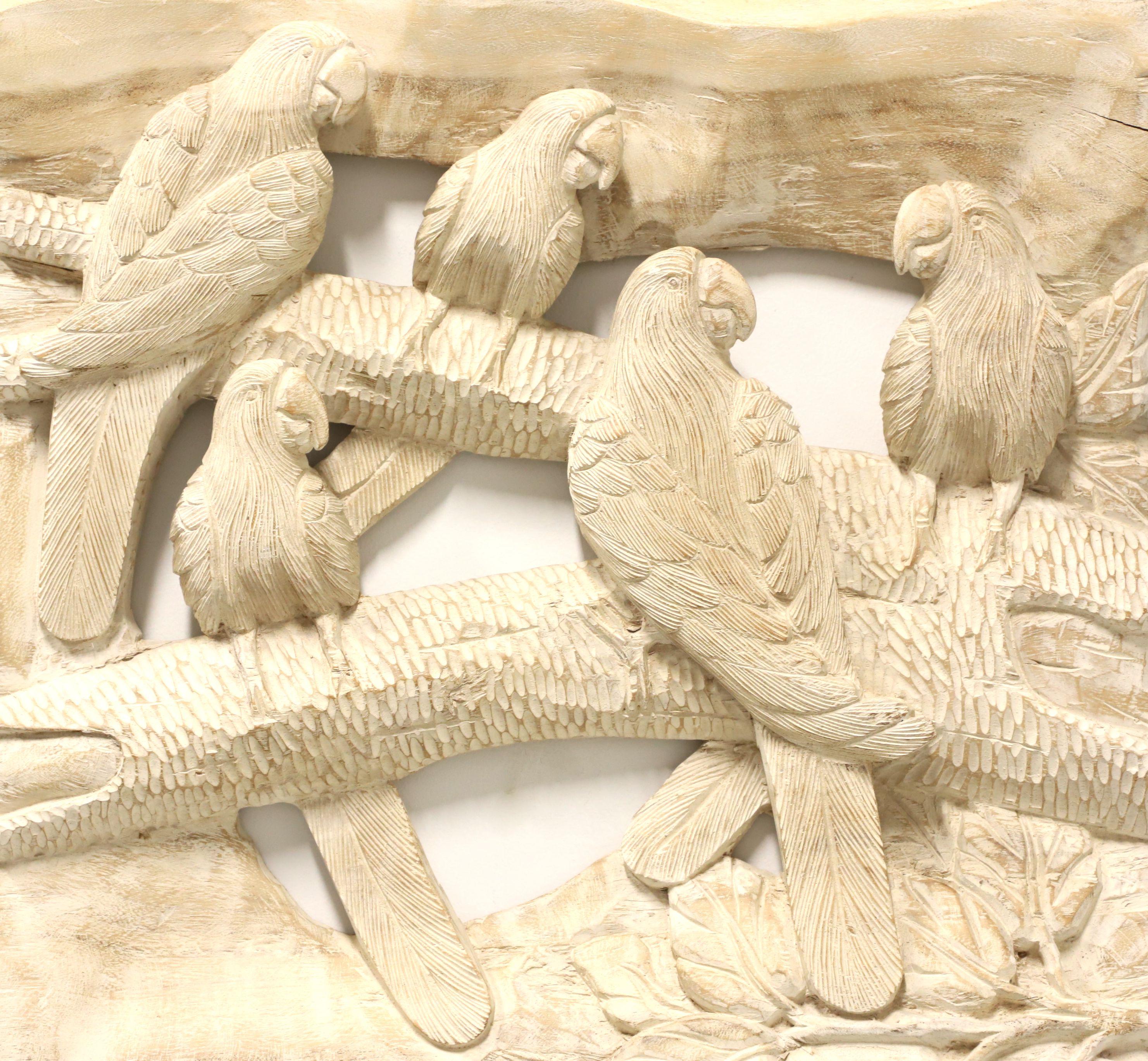 A decorative avian wood carving, from the mid 20th Century. Untitled, (Parrots in a Tree). Unsigned, artist unknown. Carved from one solid piece of wood. Metal hangers attached to back for wall hanging. Origin unknown.

Measures: Overall: 20w 2.5d