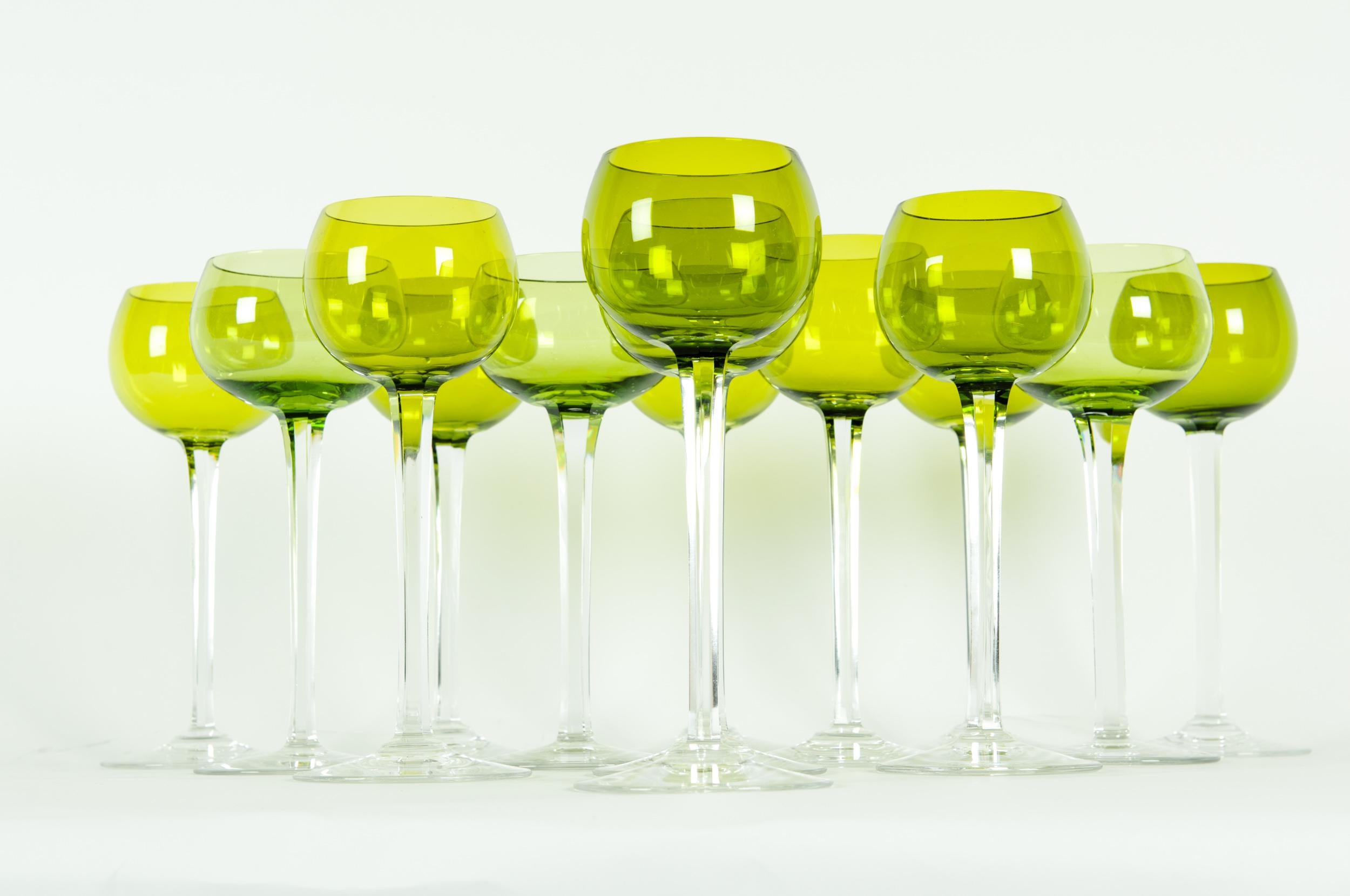Mid-20th century Baccarat crystal stemware wine service for fourteen people. Each glass is in great condition. Maker's mark undersigned. Each glass measure about 7.8 inches high x 3 inches base diameter.