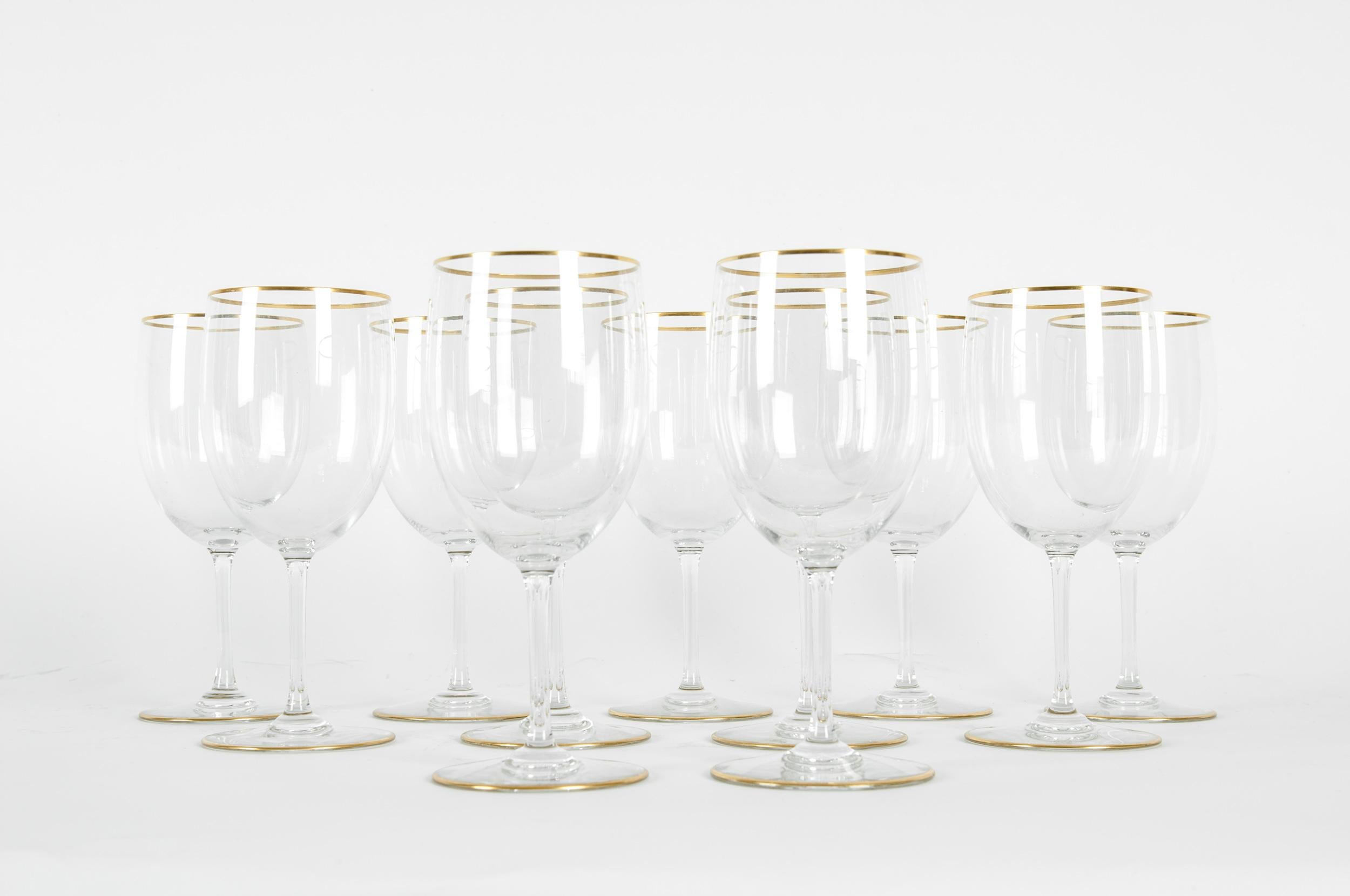 Mid-20th century Baccarat crystal stemware wine, water service for eleven people with gold trim details. Each glass is in great vintage condition. Maker's mark undersigned. Minor wear consistent with age / use . Each glass measure about 6.7 inches