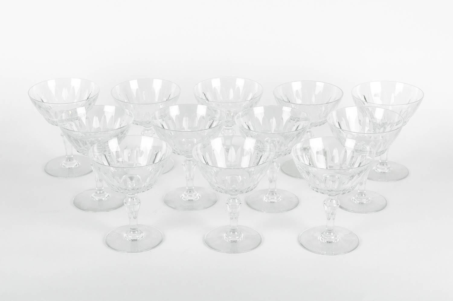 Mid-20th century Baccarat glassware champagne coupe. Each glass is in excellent condition. Each glass coupe measure 5 inches high x 4 inches top diameter. Maker's mark undersigned.
