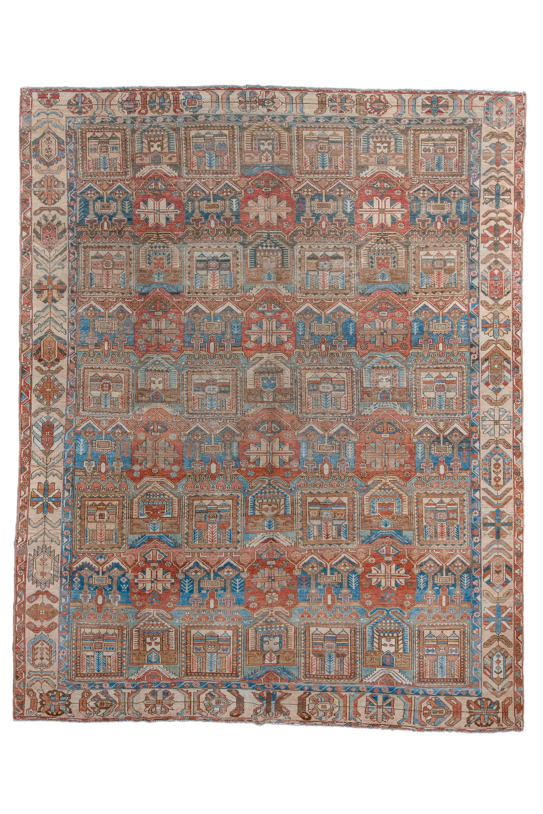 A sand border of chains of palmettes, flowers and rosettes, sets off the  closely set  seven column repeating pattern of  garden squares, single and double pent roof motives and red reserves in this Chahar Mahal village piece. Moderate/medium weave
