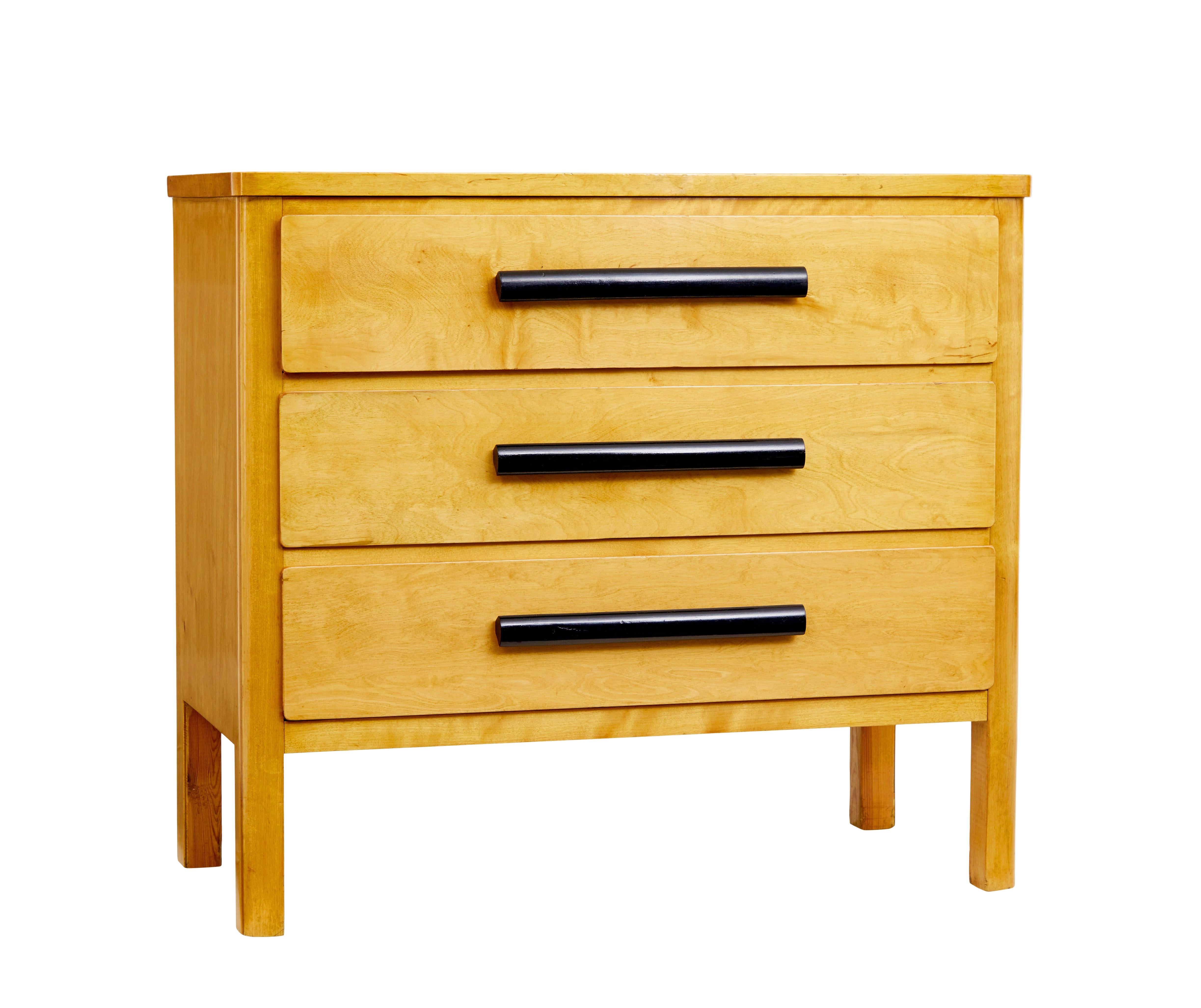 Mid 20th century birch Scandinavian chest of drawers circa 1960.

Here we have a practical piece of everyday furniture from the mid 20th Scandinavian modern period.

Slight over-sailing top surface.  Fitted with 3 drawers of equal proportions, each