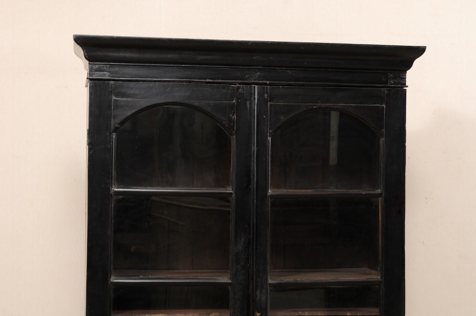 Carved Mid-20th Century Black British Colonial Tall Display Cabinet