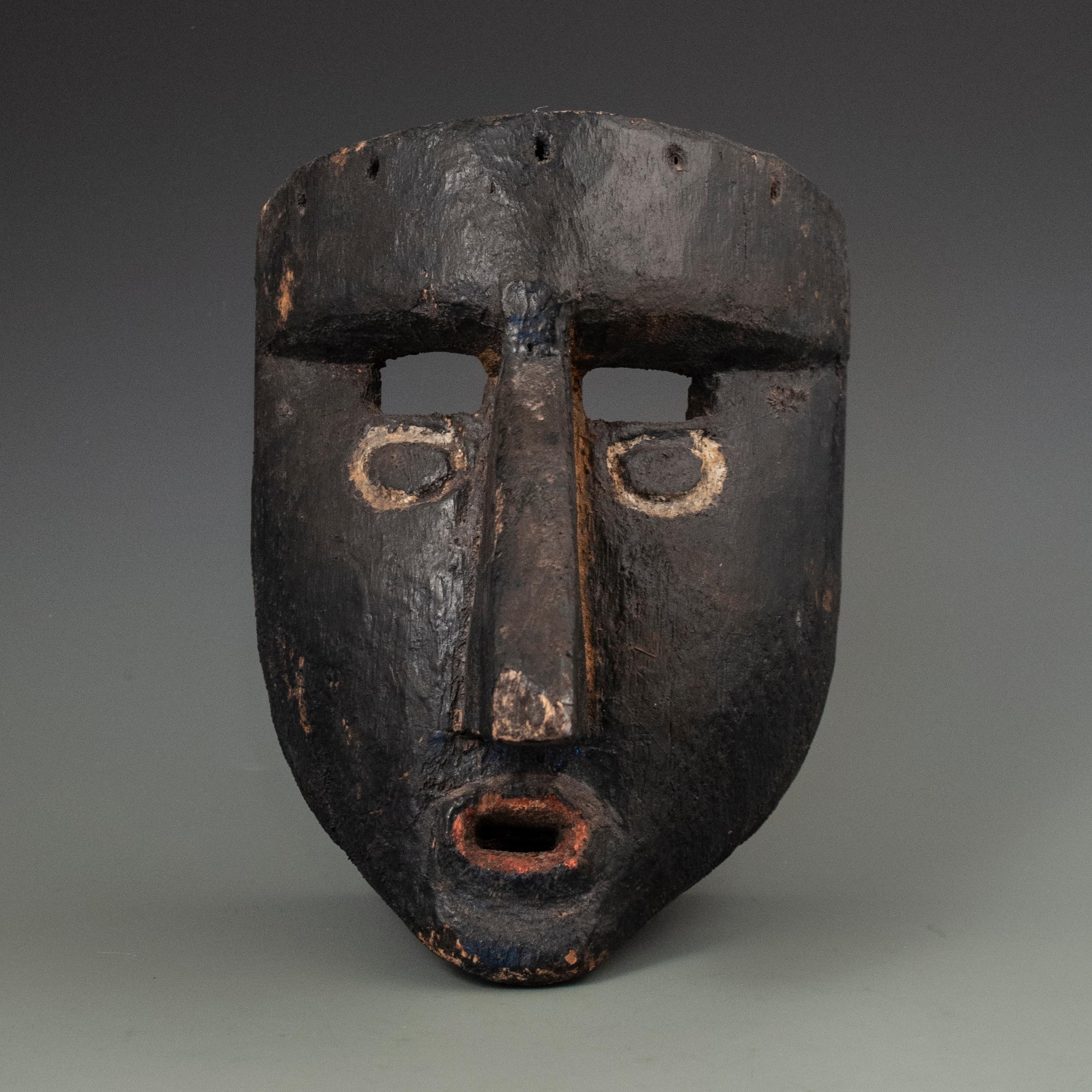 Mid-20th century black dance mask, Guerrero, Mexico

A nice old mask from Guererro, Mexico, used in the Tlacololero Dance of the Tlactapa and probably from the 1950s, has a very modern, graphic feel to it. The nose has suffered a bit from a fall and