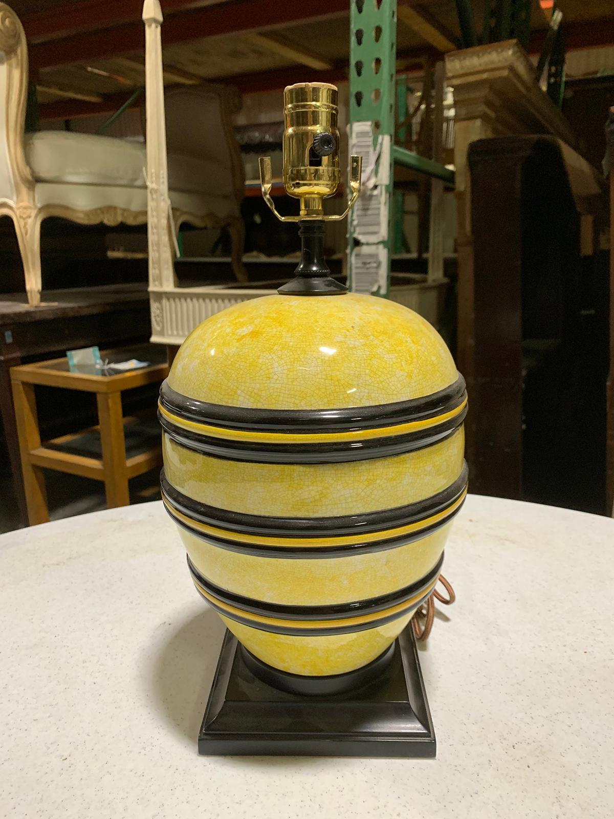 Mid-20th century black and yellow pottery lamp on custom base
New wiring.
