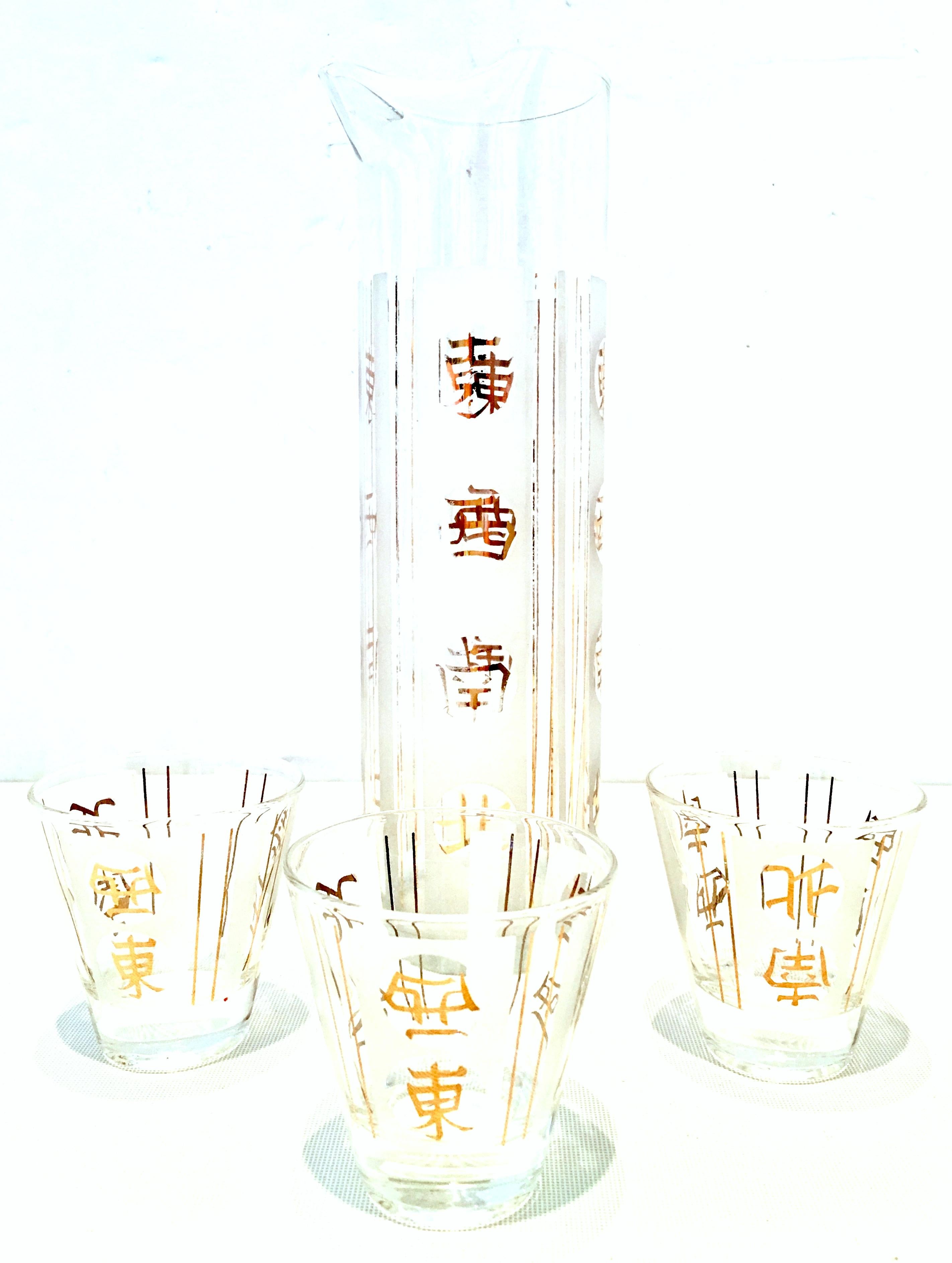 Mid-20th century blown glass and 22-karat gold Chinese symbol drinks set of four pieces. Features translucent and white frosted body with 22-karat gold Chinese symbol detail. Set includes 1 spouted drinks server and 3 shot glasses.
Measures: Shot