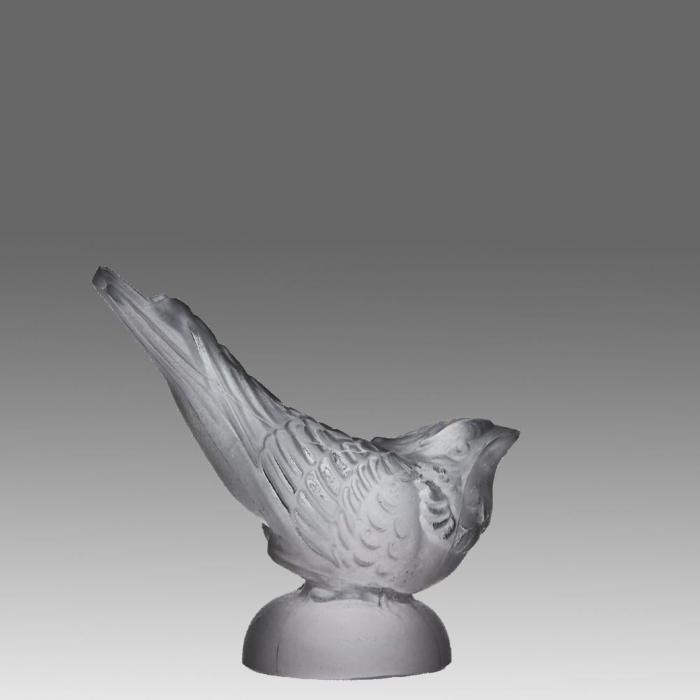 A charming frosted glass moulded glass figurine of a singing bird with good hand finished detail, with label to base 'Veritable Boheme'

ADDITIONAL INFORMATION
Height:                                      9 cm     

Length:                          