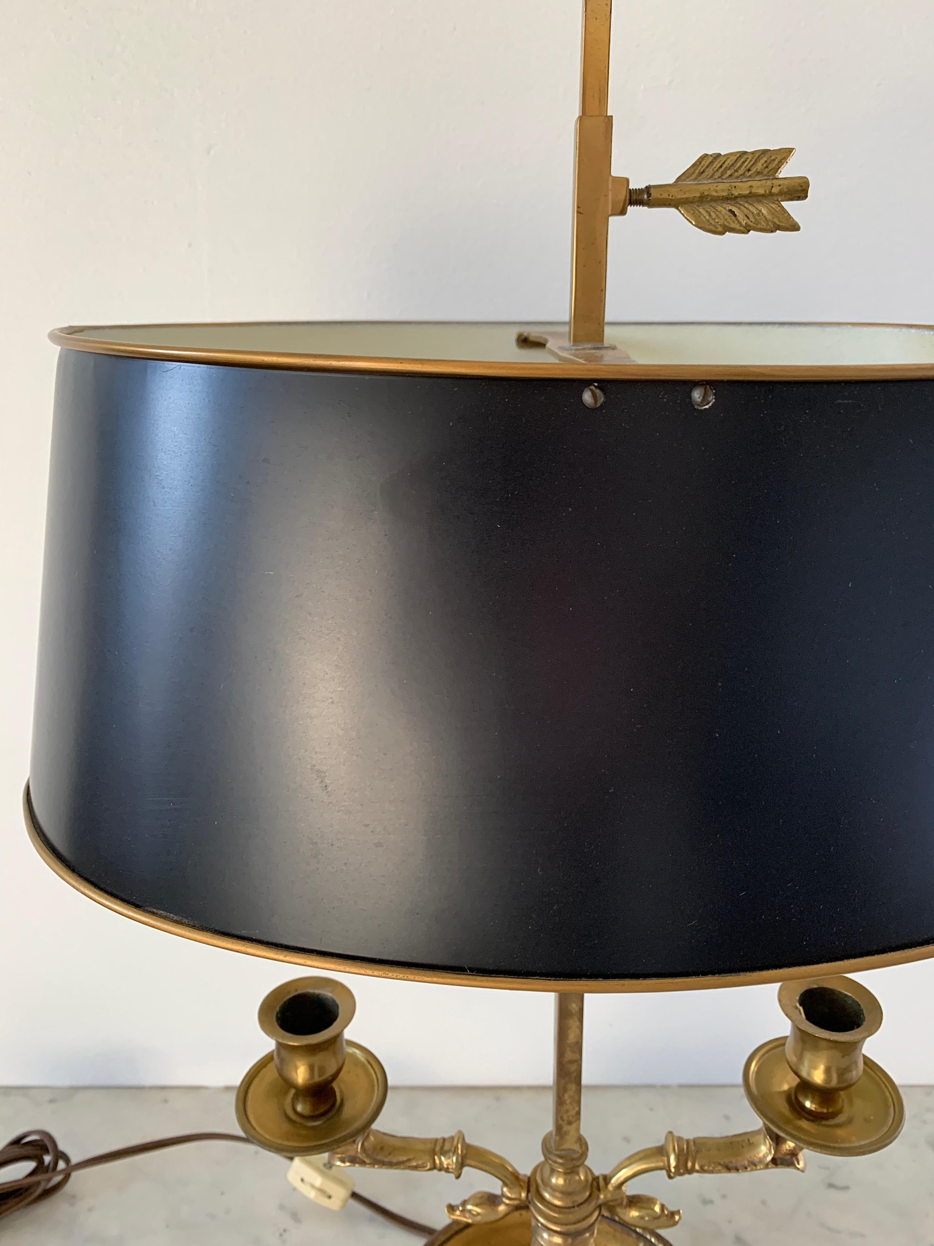French Provincial Mid-20th Century Brass Bouillotte Double Dolphin Lamp with Black Tole Shade For Sale