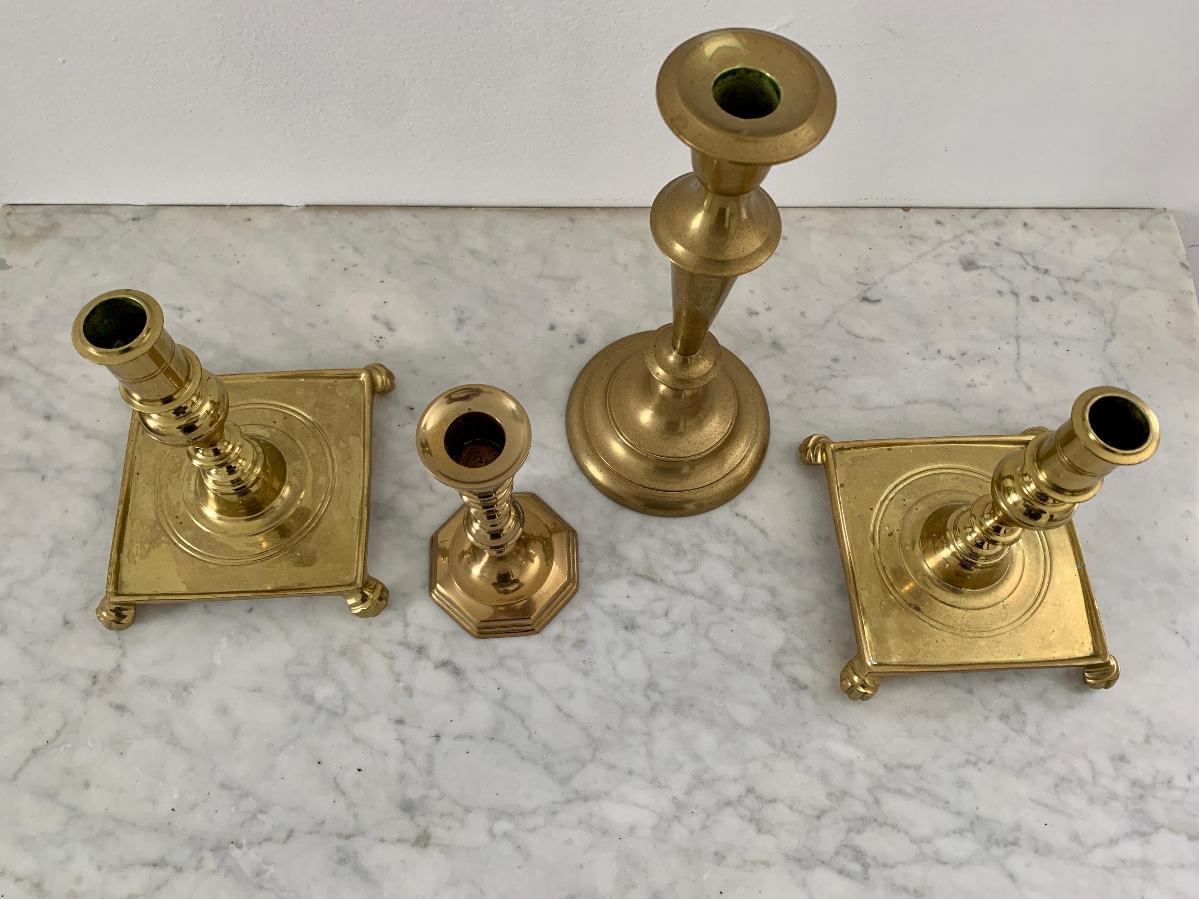 A beautiful set of four brass candlestick holders

Mid-20th Century

Tallest measures: 4.63