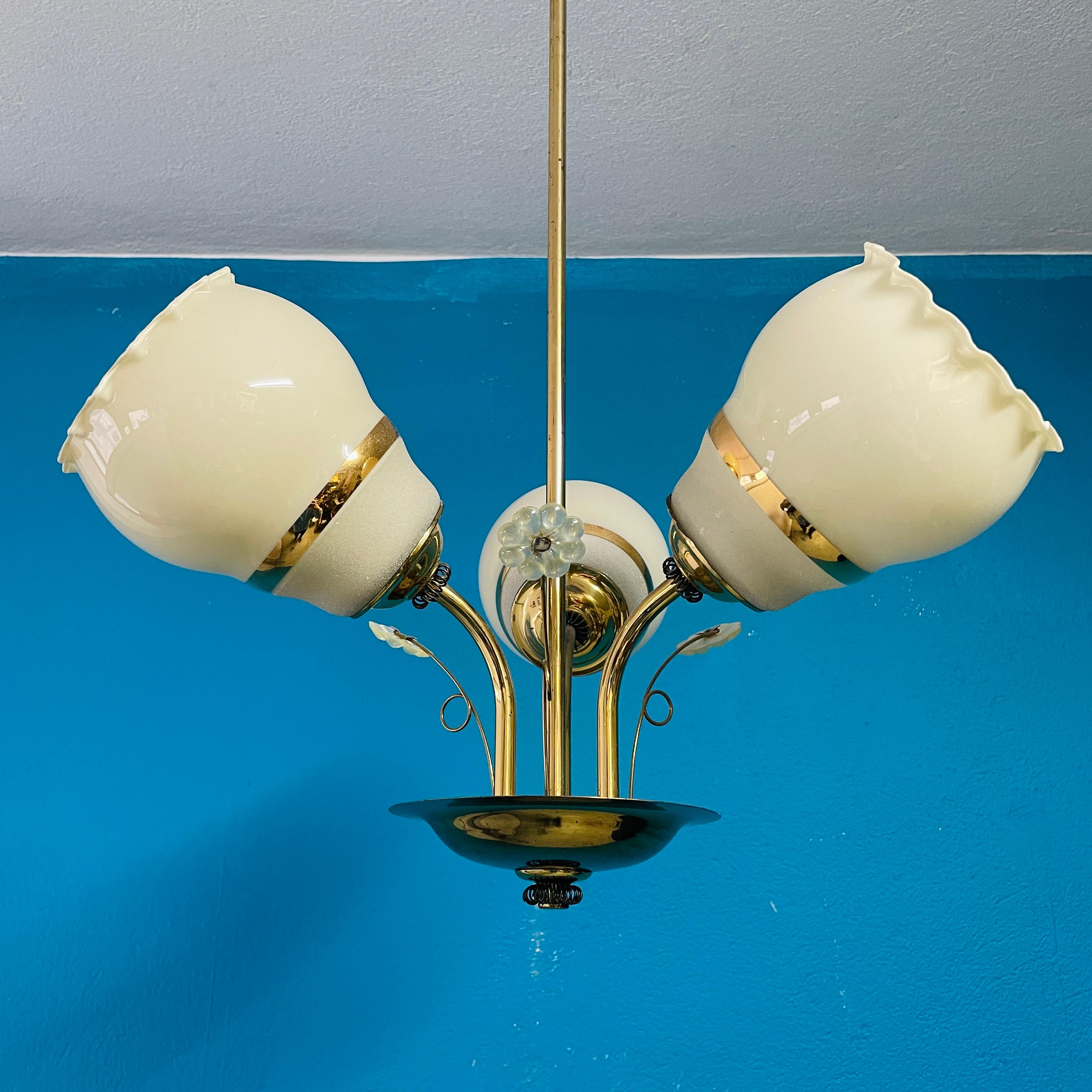 Beautiful 3-arm Tynell Style Chandelier / Pendant from 1950's. Manufactured by Sario Finland. 

Materials:
the Frame and decorations are made of brass and shades are blown glass.

- Height 72cm / 28in 
- E26/E27 bulb
- Re-Wired at some point. Works