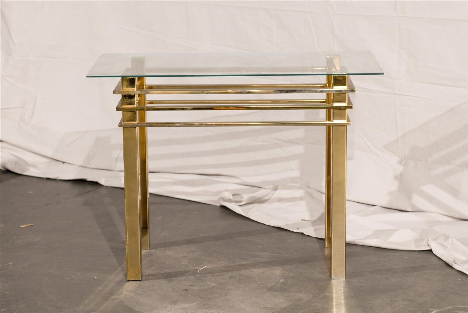 Mid-20th century brass console table with glass top.