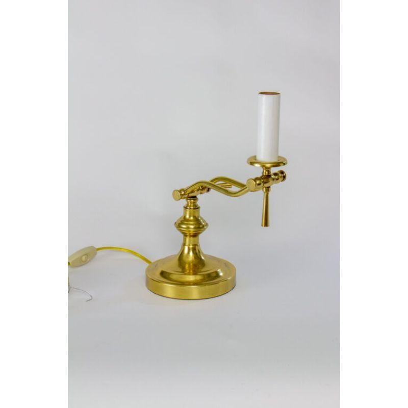 Brass piano lamp. Adjusts in two places for light where you need it. Can be used with or without a shade. Completely restored and rewired. Measurements are of the lamp adjusted as photographed. Height is to top of candlecover, without bulb or