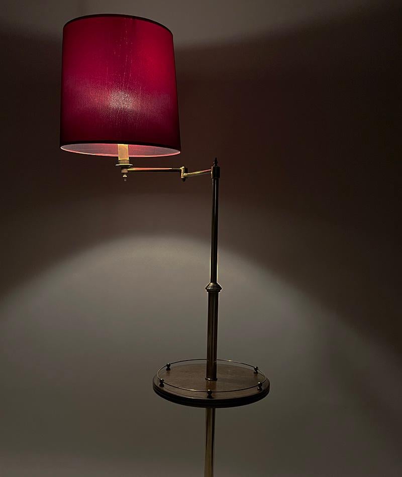Mid 20th Century brass swingarm Floor lamp and side table

A brass swingarm and adjustable floor lamp with oak wooden central side table with balustrade. Measured up to the height of the side arm is 136 cm and up to the height of the fitting is 145