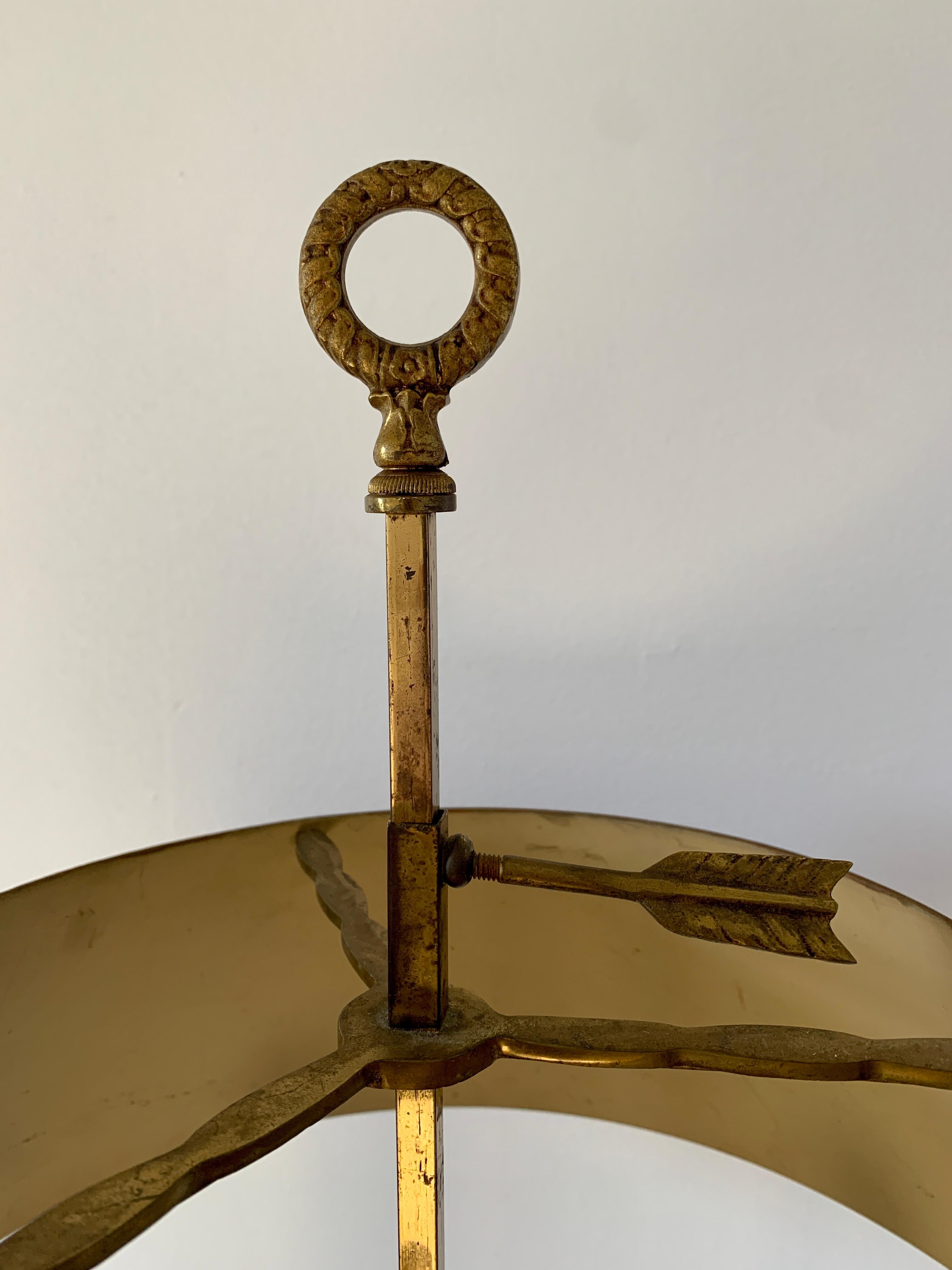 A gorgeous brass three-arm bouillotte lamp with red & gold tole shade

USA, Circa 1950s

Measures: 12.75